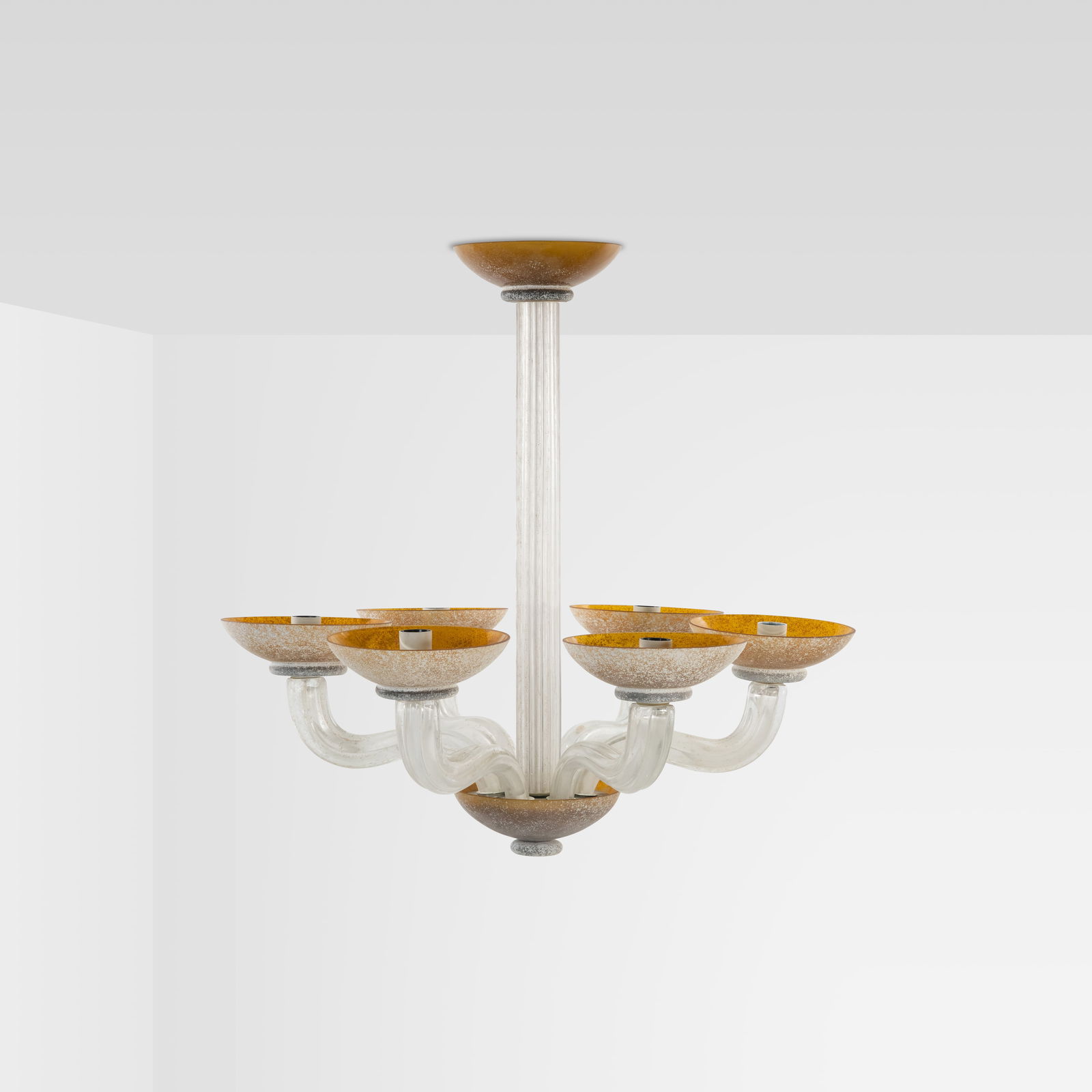 Karl Springer - Chandelier: A six light 'scavo' glass chandelier produced by Seguso for Karl Springer. Measurements provided are for the fixture itself. The chain drop is approximately 14" tall. All measurements are Height x Wid