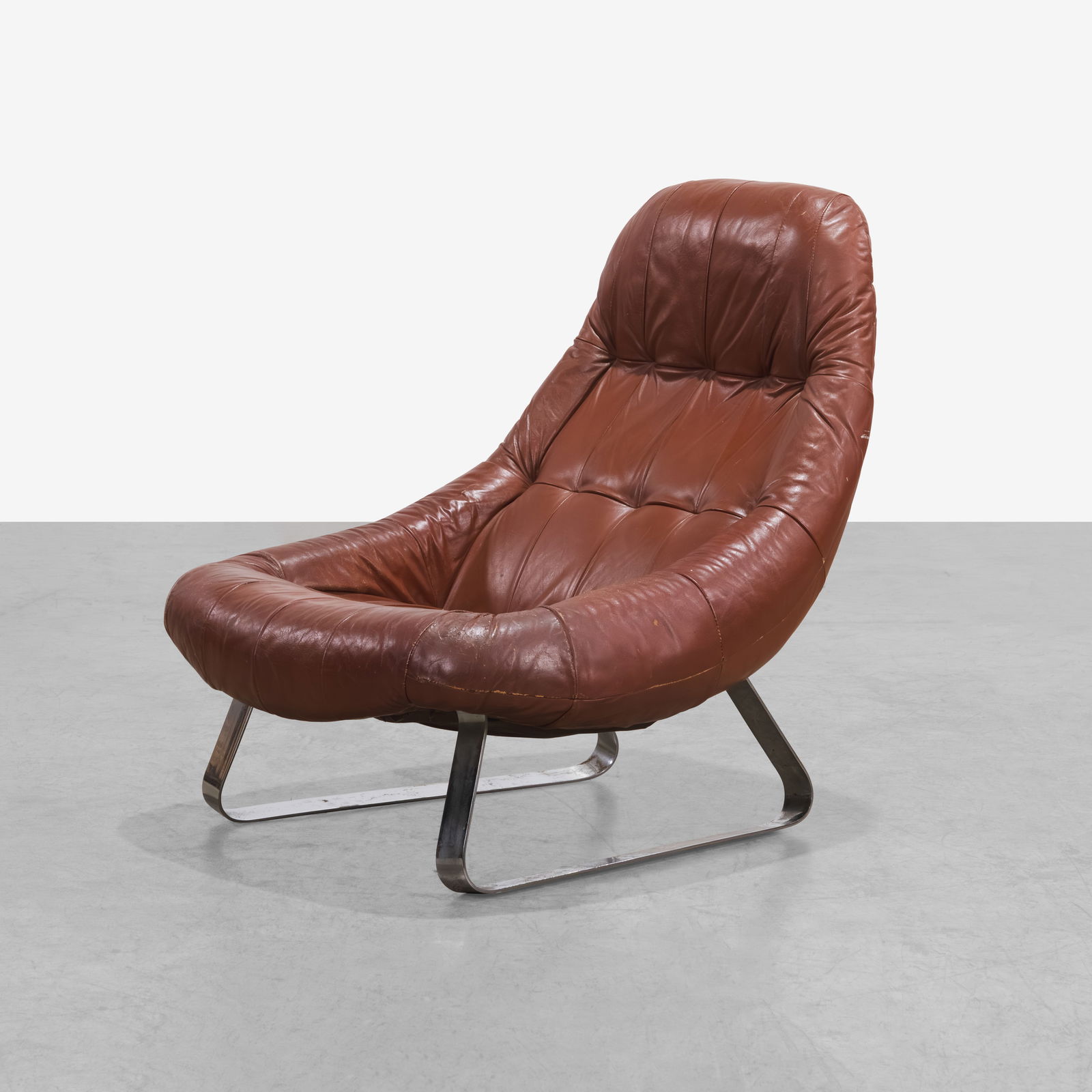 Percival Lafer - Earth Lounge: A vintage 'Earth' chair in leather and steel by Percival Lafer. All measurements are Height x Width x Depth.