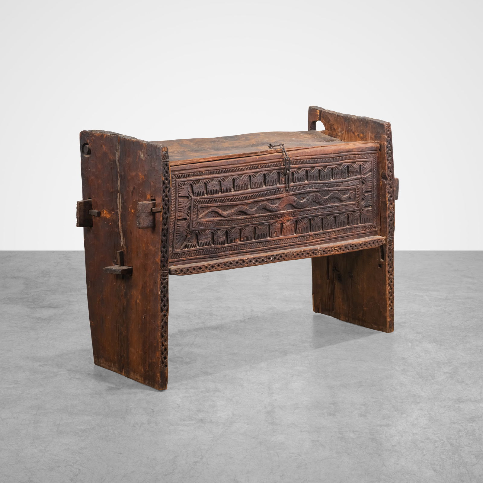 Antique Nuristan Chest: A carved antique chest with snake motif from Nuristan (Afghanistan). All measurements are Height x Width x Depth.