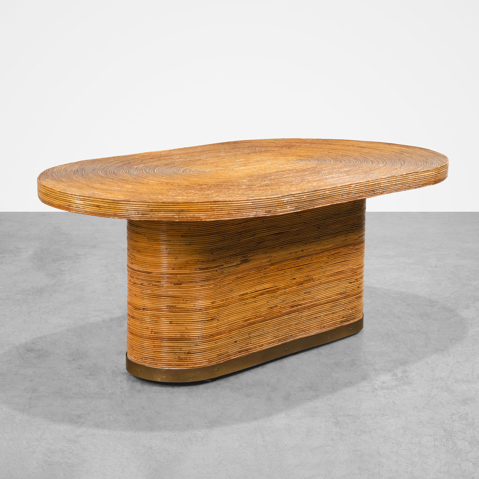 Pencil Rattan Dining Table: A pencil rattan and brass dining table in the manner of Gabriella Crespi. All measurements are Height x Width x Depth.