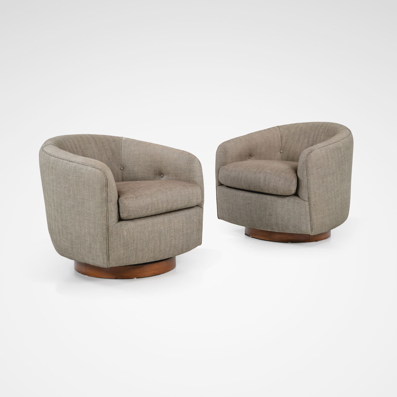 Milo Baughman - Tilt & Swivel Club Chairs: A pair of tilt and swivel club chairs by Milo Baughman on wooden bases. All measurements are Height x Width x Depth.