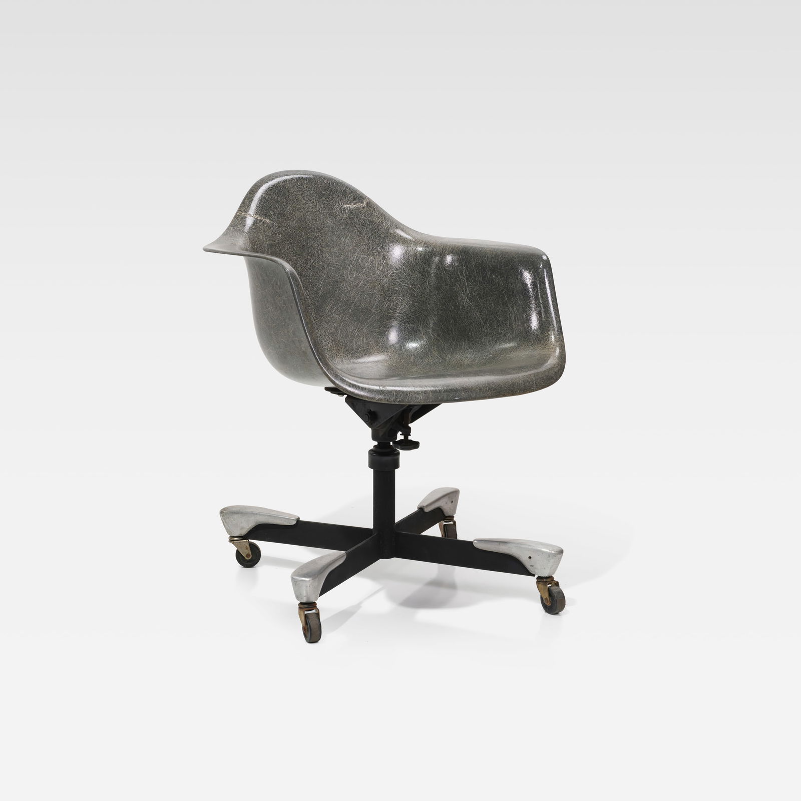 Charles & Ray Eames - Desk Chair: A rope edge fiberglass desk chair by Charles and Ray Eames for Herman Miller. All measurements are Height x Width x Depth.