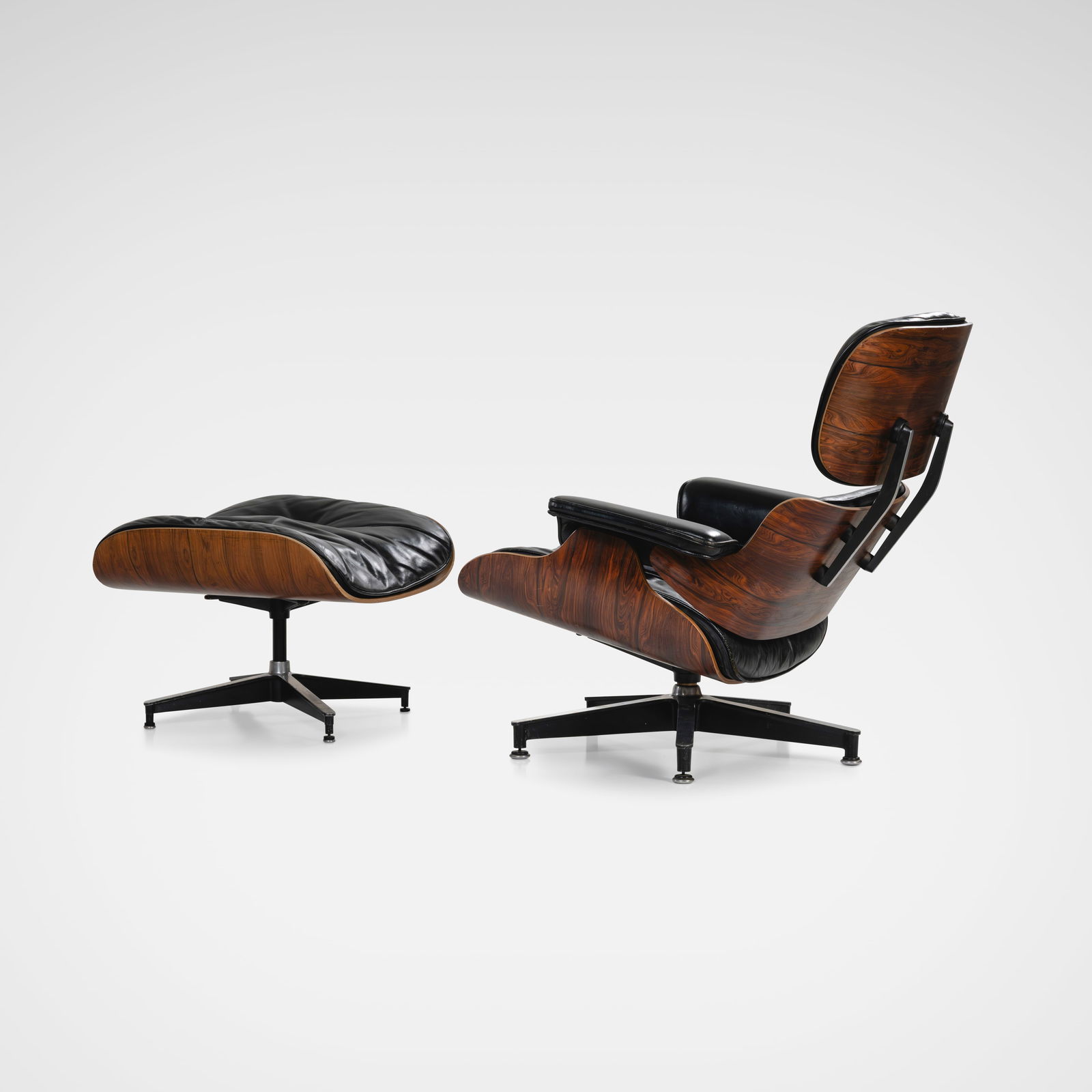 Charles & Ray Eames - Lounge Chair & Ottoman: A vintage model 670 lounge chair and model 671 ottoman in rosewood and leather by Charles and Ray Eames for Herman Miller. Second generation production. All measurements are Height x Width x Depth.