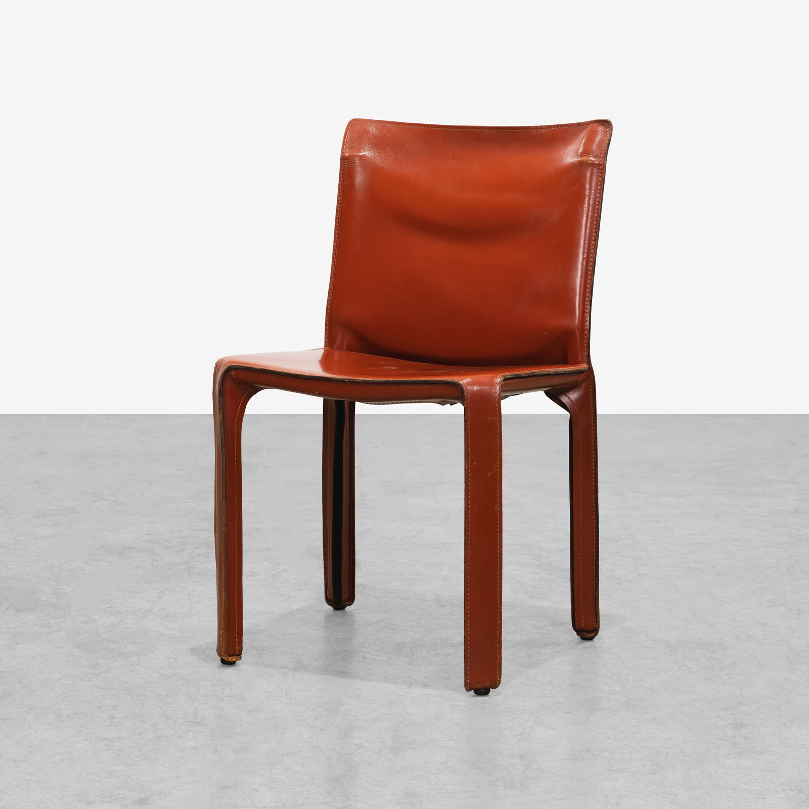 Mario Bellini - Cab Chair: A red leather Cab side chair by Mario Bellini for Cassina, Italy. All measurements are Height x Width x Depth.