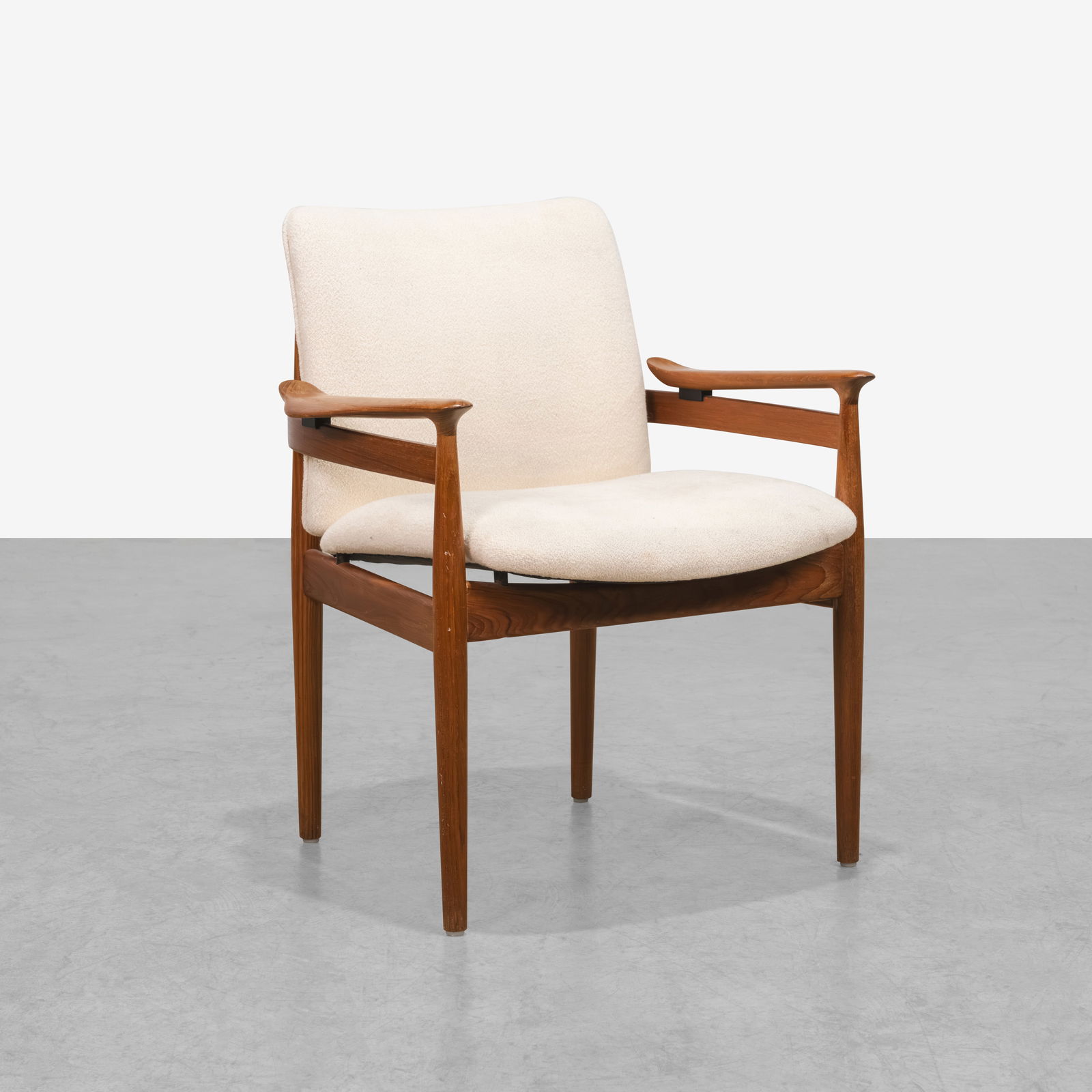 Finn Juhl - Armchair: A vintage teak armchair, model FD192, by Finn Juhl. All measurements are Height x Width x Depth.