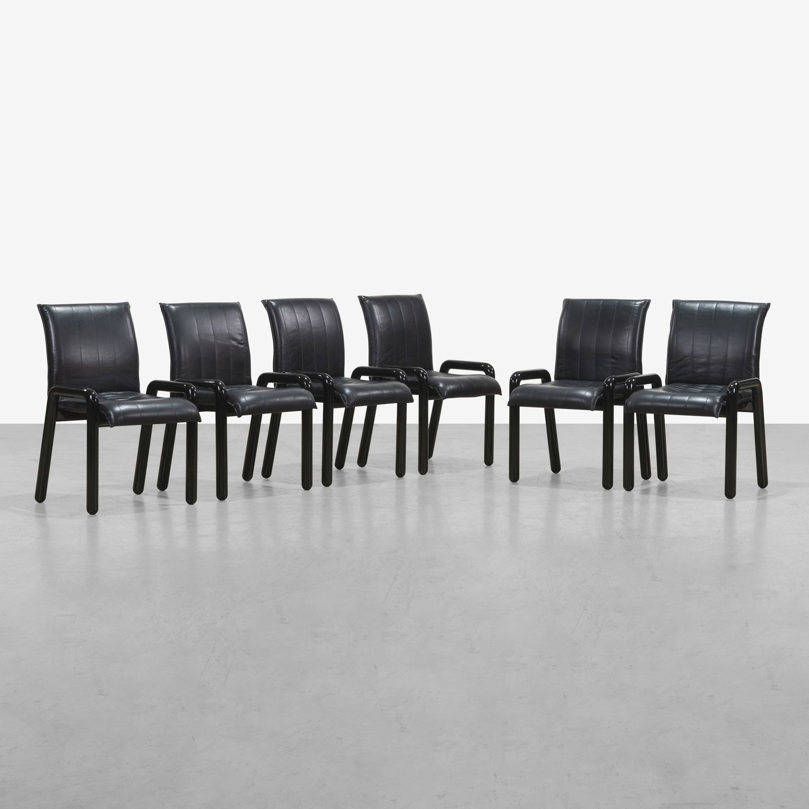 Guido Faleschini - Dining Chairs: A set of six black lacquer and leather dining chairs by Guido Faleschini for Mariani / Pace, Italy. All measurements are Height x Width x Depth.