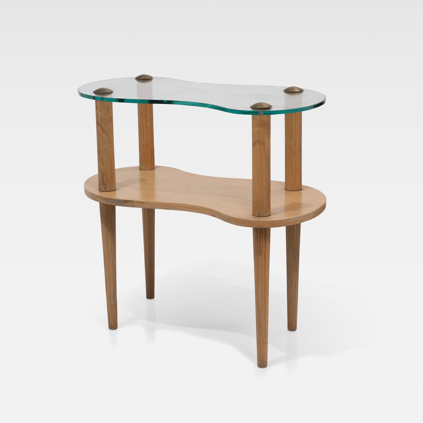 Gilbert Rohde (After) - End Table: A biomorphic glass, brass, and oak end table in the manner of Gilbert Rohde. All measurements are Height x Width x Depth.