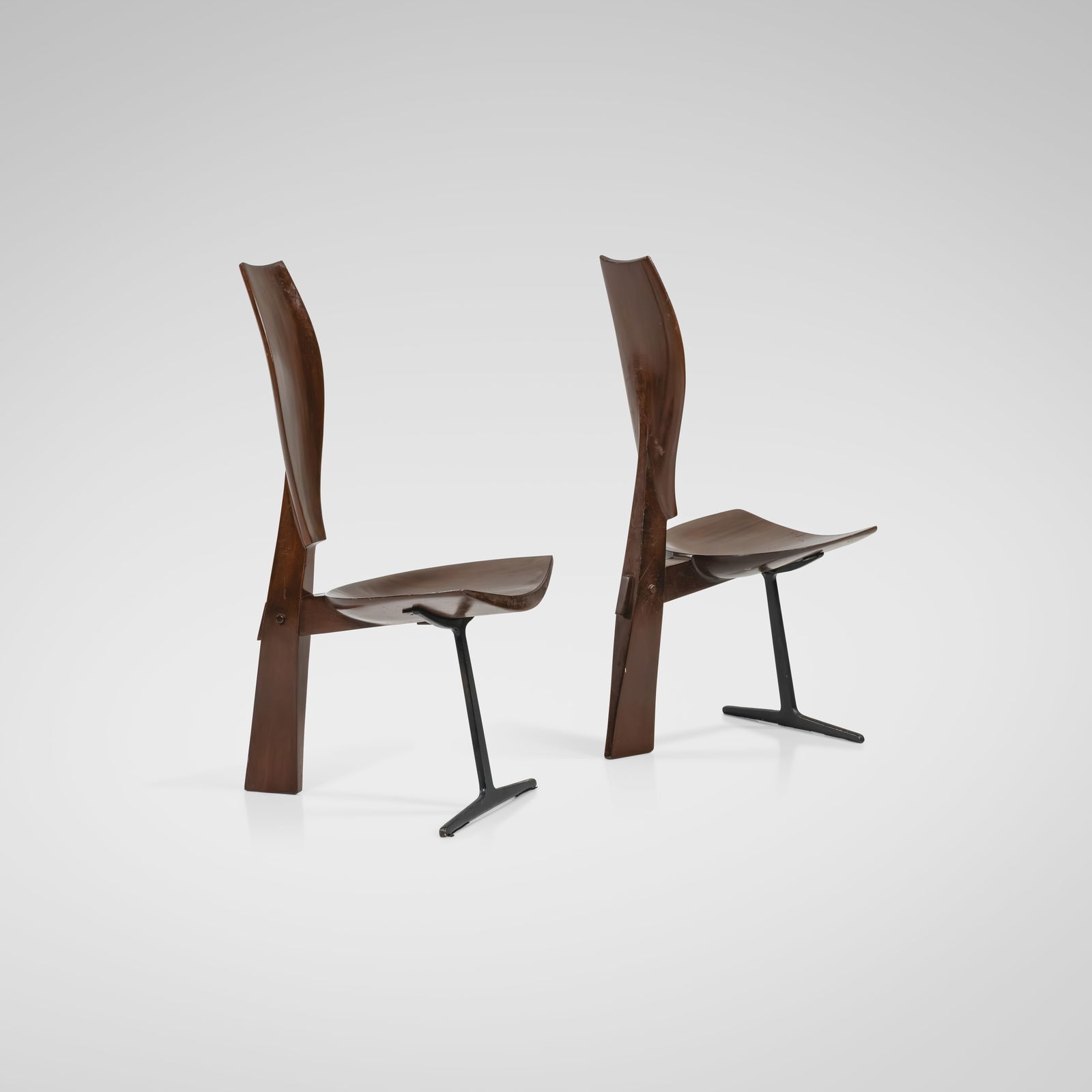 Studio Crafted Chairs: A pair of studio crafted chairs with patinated bronze bases and sculpted backrests. Unknown maker. All measurements are in inches. Height x Width x Depth