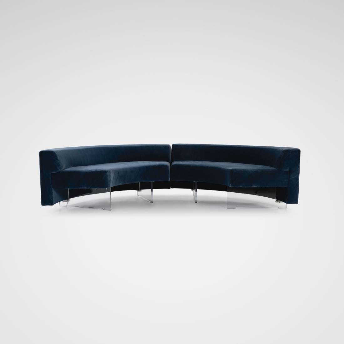 Vladimir Kagan - Crescent Sofas: A pair of crescent banquet sofas by Vladimir Kagan. Legs have been altered to raise the height. Listed dimensions are for each half. All measurements are in inches. Height x Width x Depth