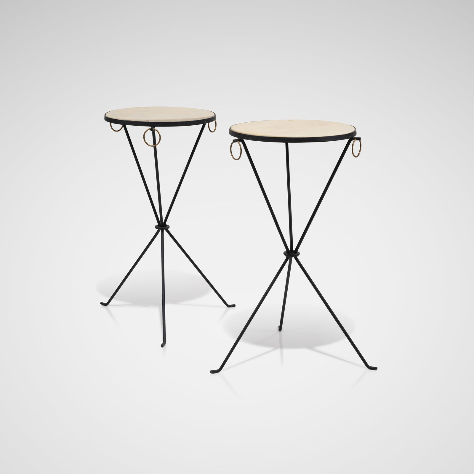 Jean Michel Frank (After) - Tables: A pair of iron and parchment drink tables in the manner of Jean Michel Frank. All measurements are in inches. Height x Width x Depth