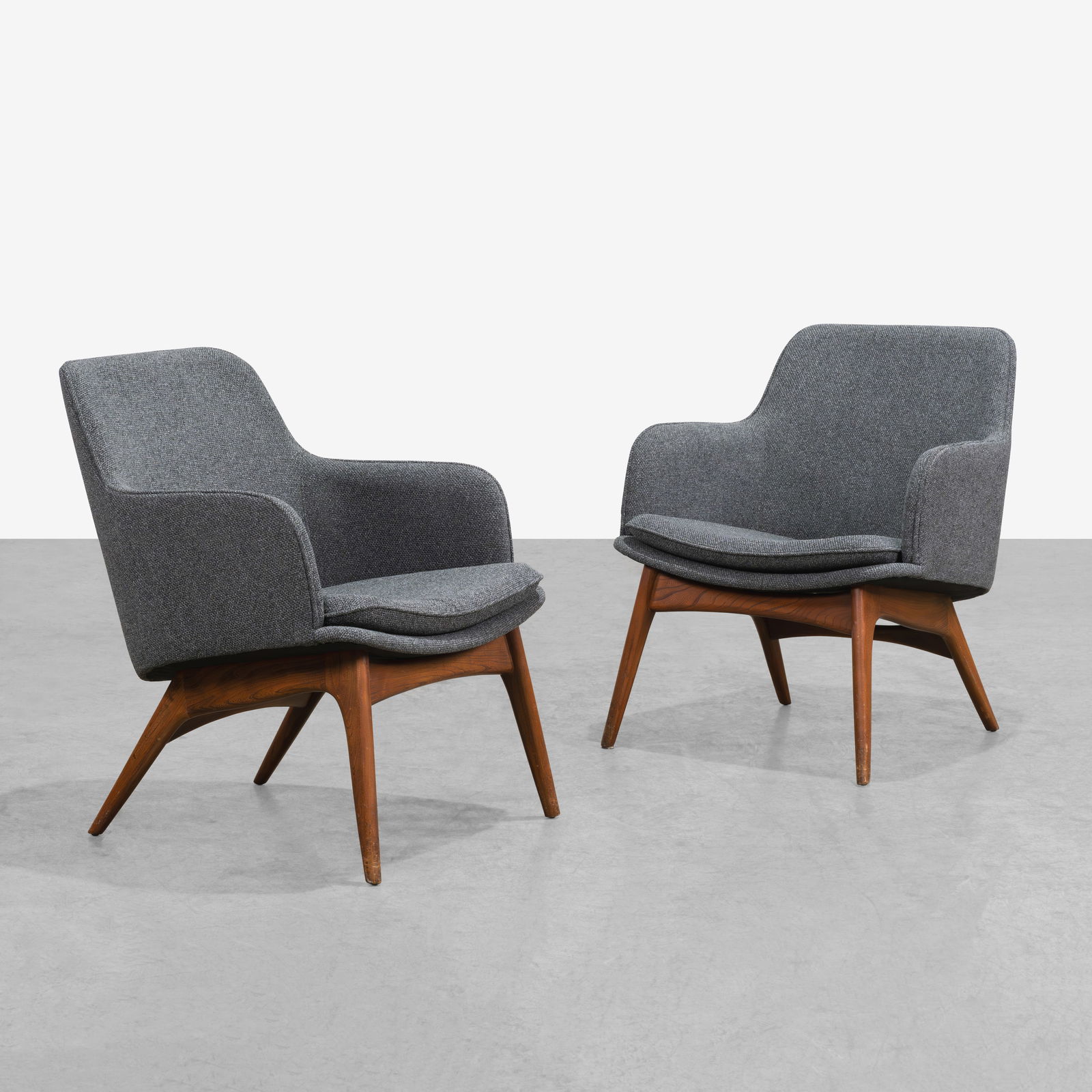 Adrian Pearsall - Chairs: A pair of arm chairs with walnut bases by Adrian Pearsall for Craft Associates. All measurements are in inches. Height x Width x Depth