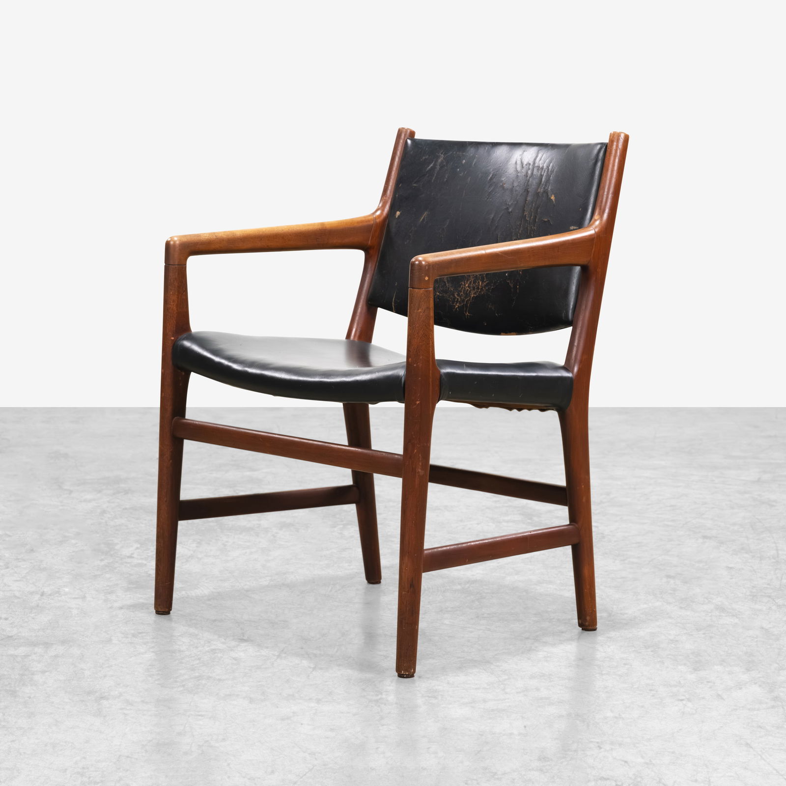 Hans Wegner - Armchair: A teak and leather Model JH-507 arm chair by Hans Wegner for Johannes Hansen. All measurements are in inches. Height x Width x Depth