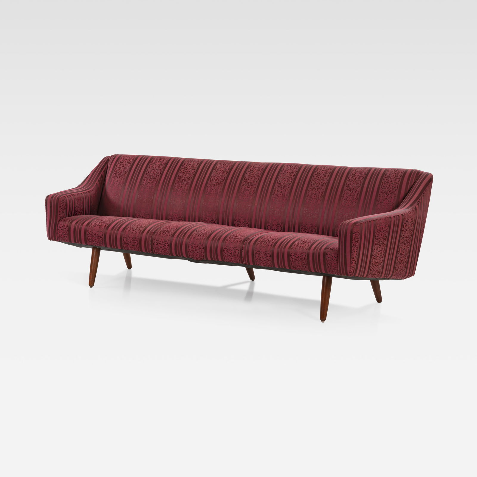 Georg Thams - Sofa: A vintage sofa with teak legs by Georg Thams. All measurements are in inches. Height x Width x Depth