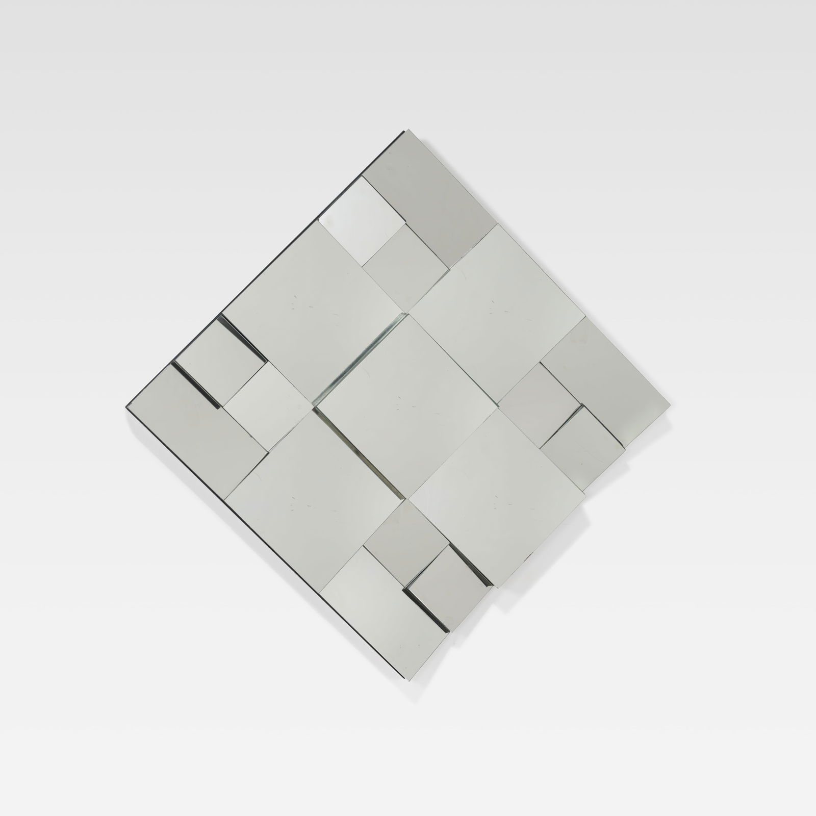 Neal Small - Faceted Mirror: A vintage 'Slopes' mirror by Neal Small. All measurements are in inches. Height x Width x Depth