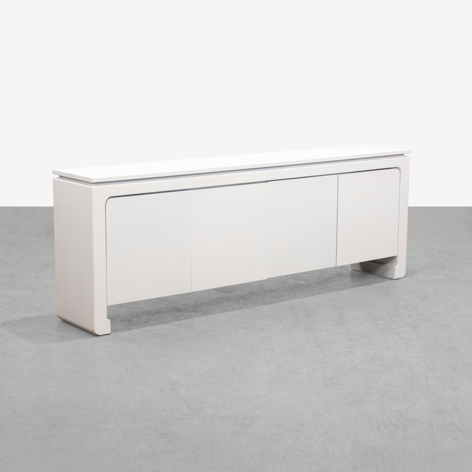 Linen Wrapped Credenza: A white linen wrapped credenza featuring a finished back. All measurements are in inches. Height x Width x Depth