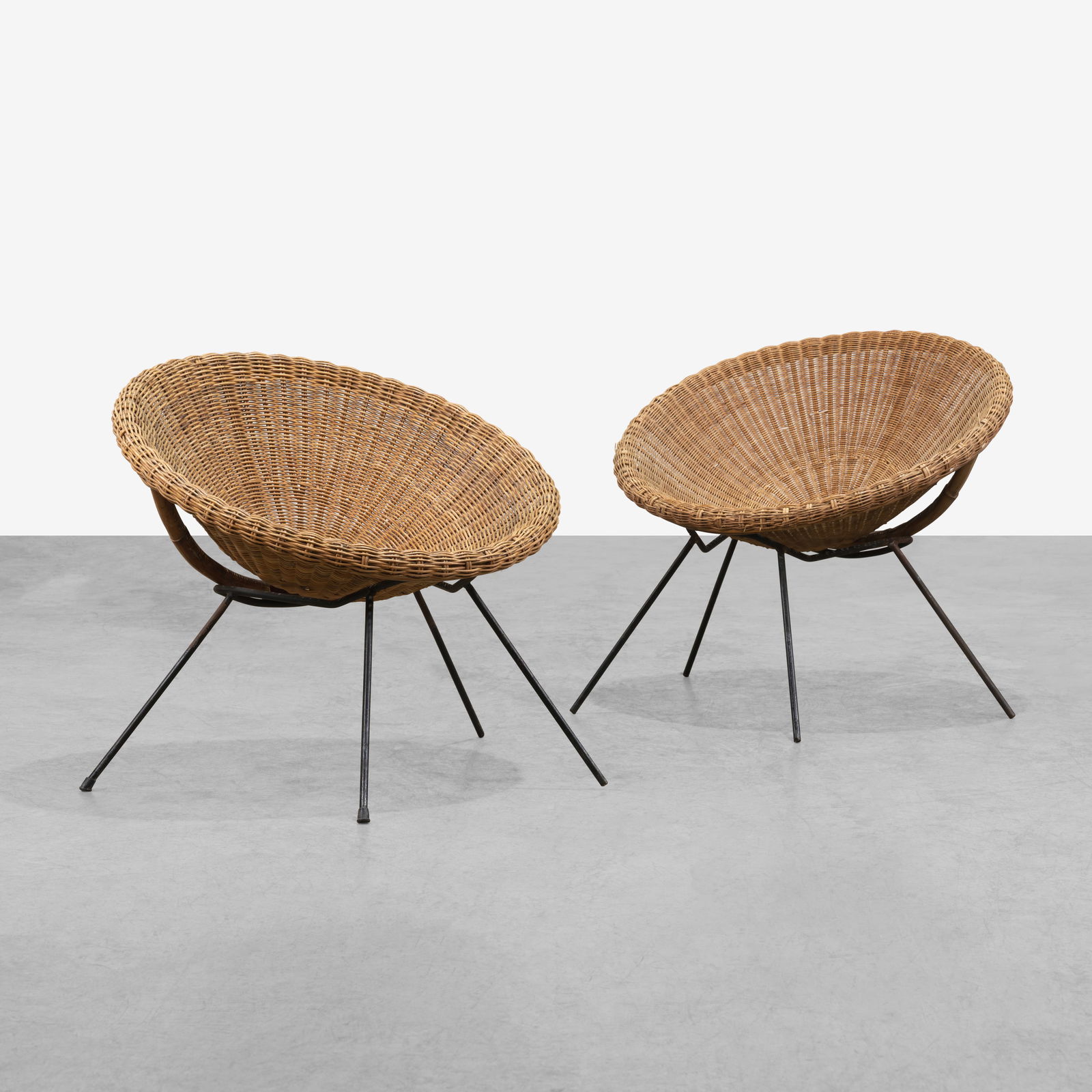 Wicker Hoop Chairs: A pair of vintage wicker and iron hoop chairs. All measurements are in inches. Height x Width x Depth