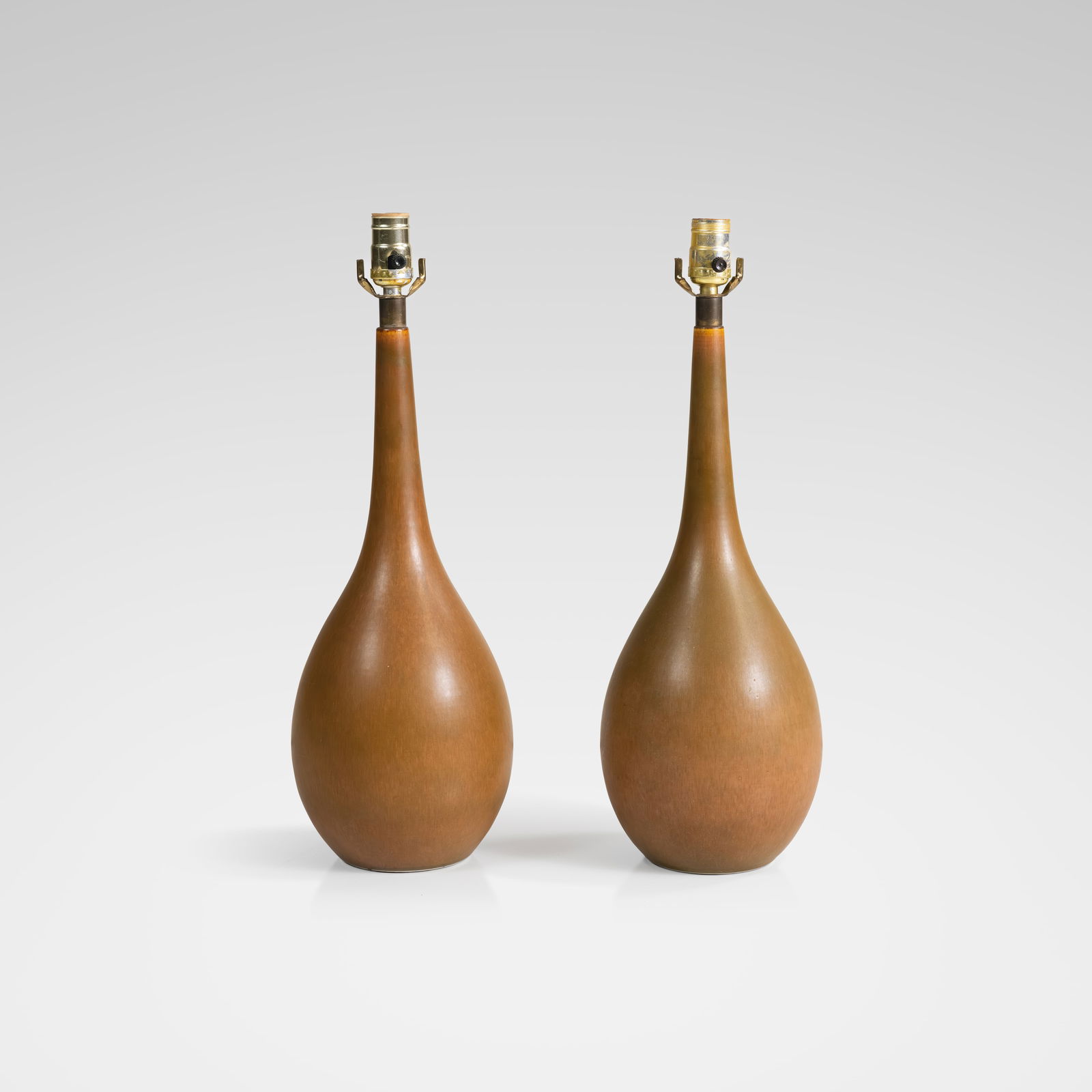 Lotte & Gunnar Bostlund - Lamps: A pair of Model 100 pottery lamps by Lotte and Gunnar Bostlund. All measurements are in inches. Height x Width x Depth