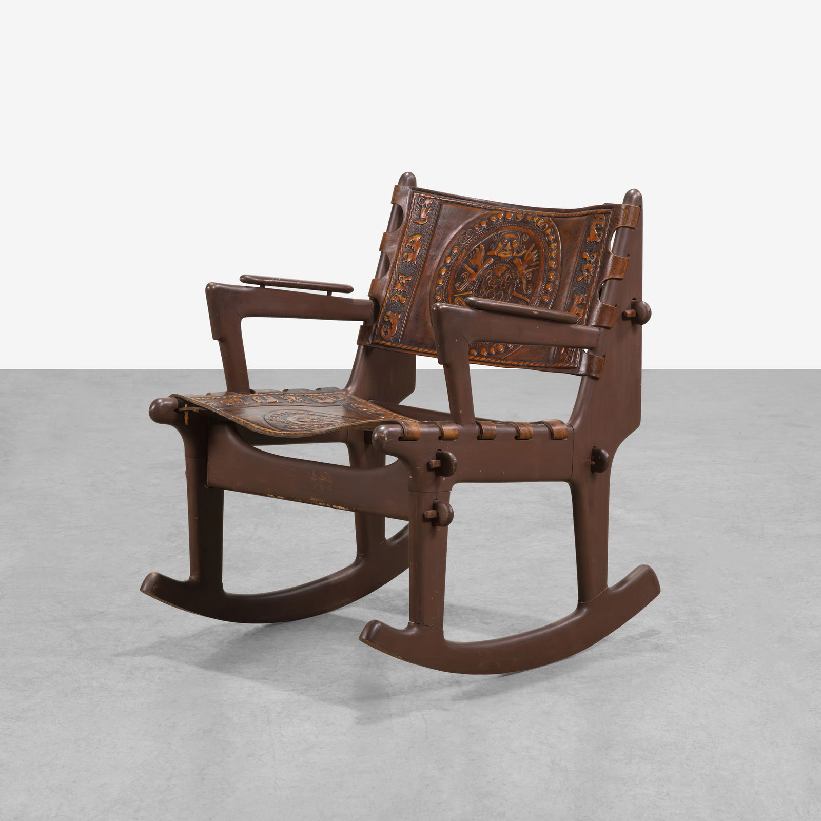 Angel Pazmino - Rocking Chair: An embossed leather sling rocking chair by Angel Pazmino. All measurements are in inches. Height x Width x Depth