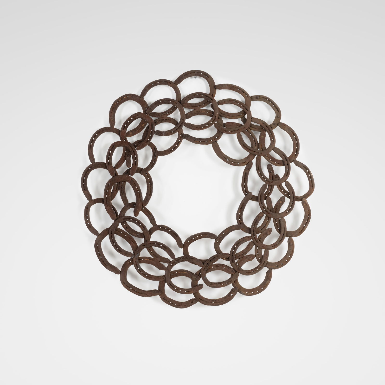 Horseshoe Sculpture: A vintage wall sculpture or mirror frame made of horseshoes. All measurements are in inches. Height x Width x Depth