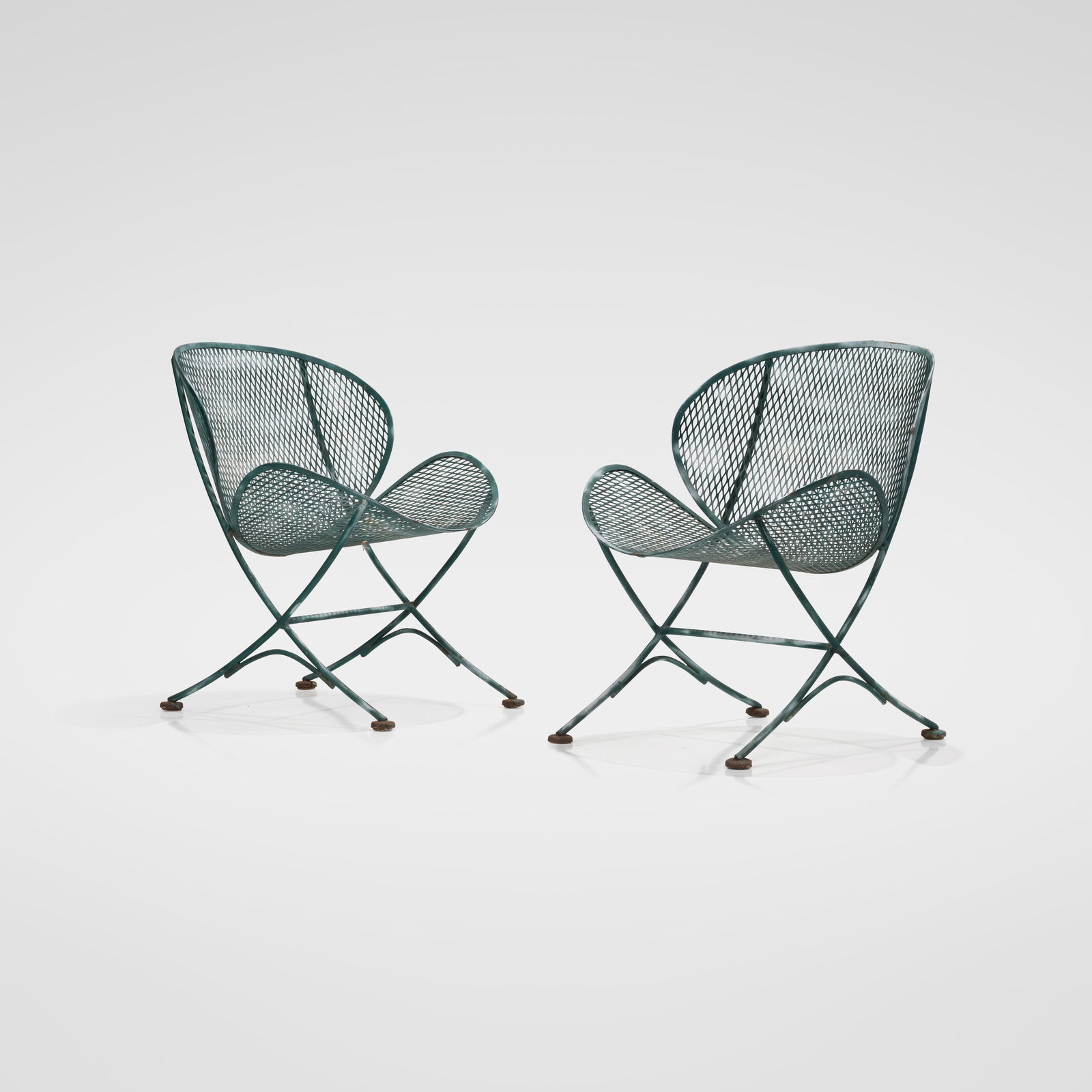 Maurizio Tempestini - Iron Chairs: A pair of clam-form iron patio chairs by Maurizio Tempestini for Salterini. All measurements are in inches. Height x Width x Depth