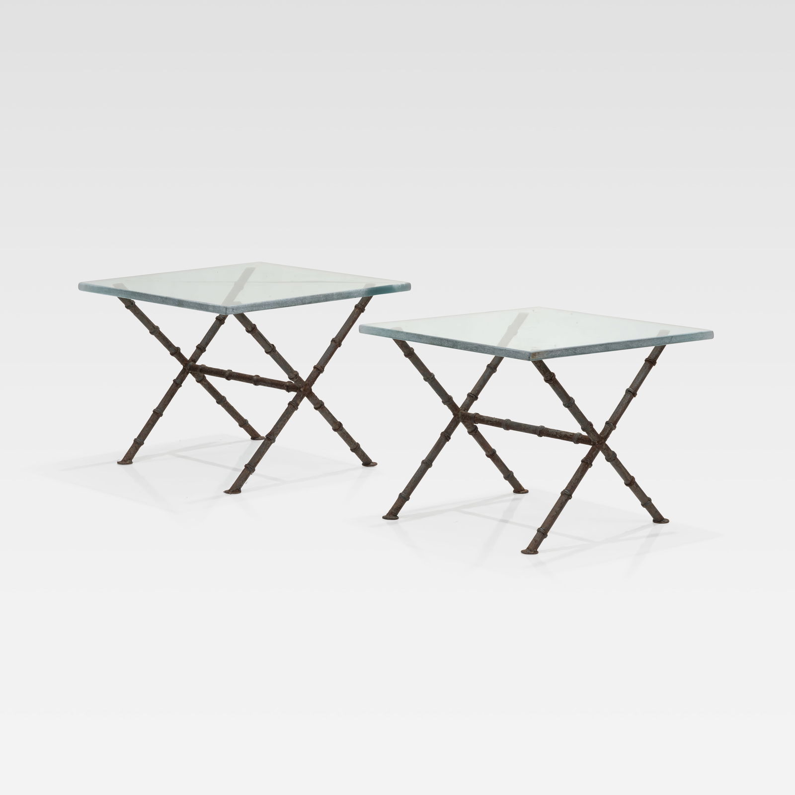 Faux Bois Iron & Glass Tables: A pair of faux bois iron and glass tables. All measurements are in inches. Height x Width x Depth