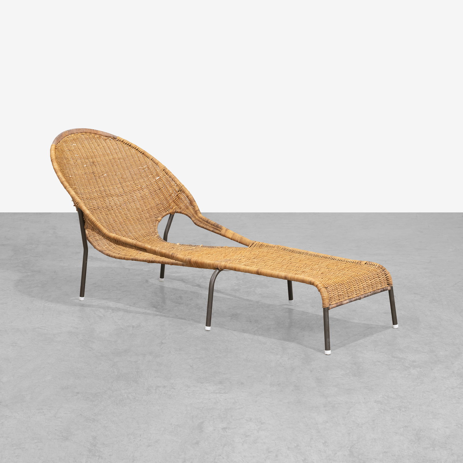 Wicker Chaise: A vintage wicker chaise in the manner of Francis Mair. All measurements are in inches. Height x Width x Depth