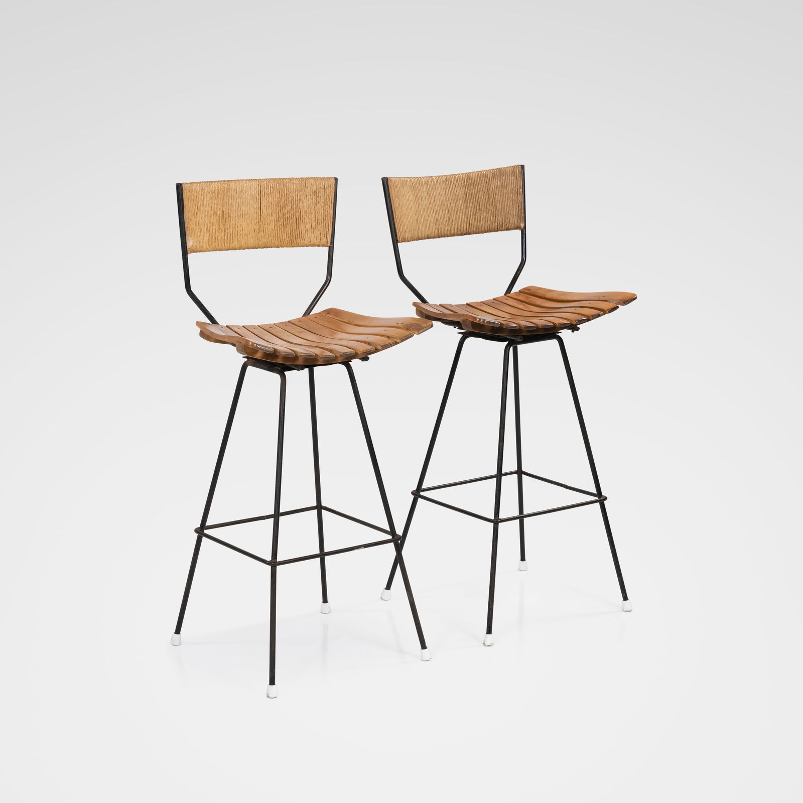 Arthur Umanoff - Bar Stools: A pair of bar stools with slat seats and rope back rests by Arthur Umanoff. All measurements are in inches. Height x Width x Depth