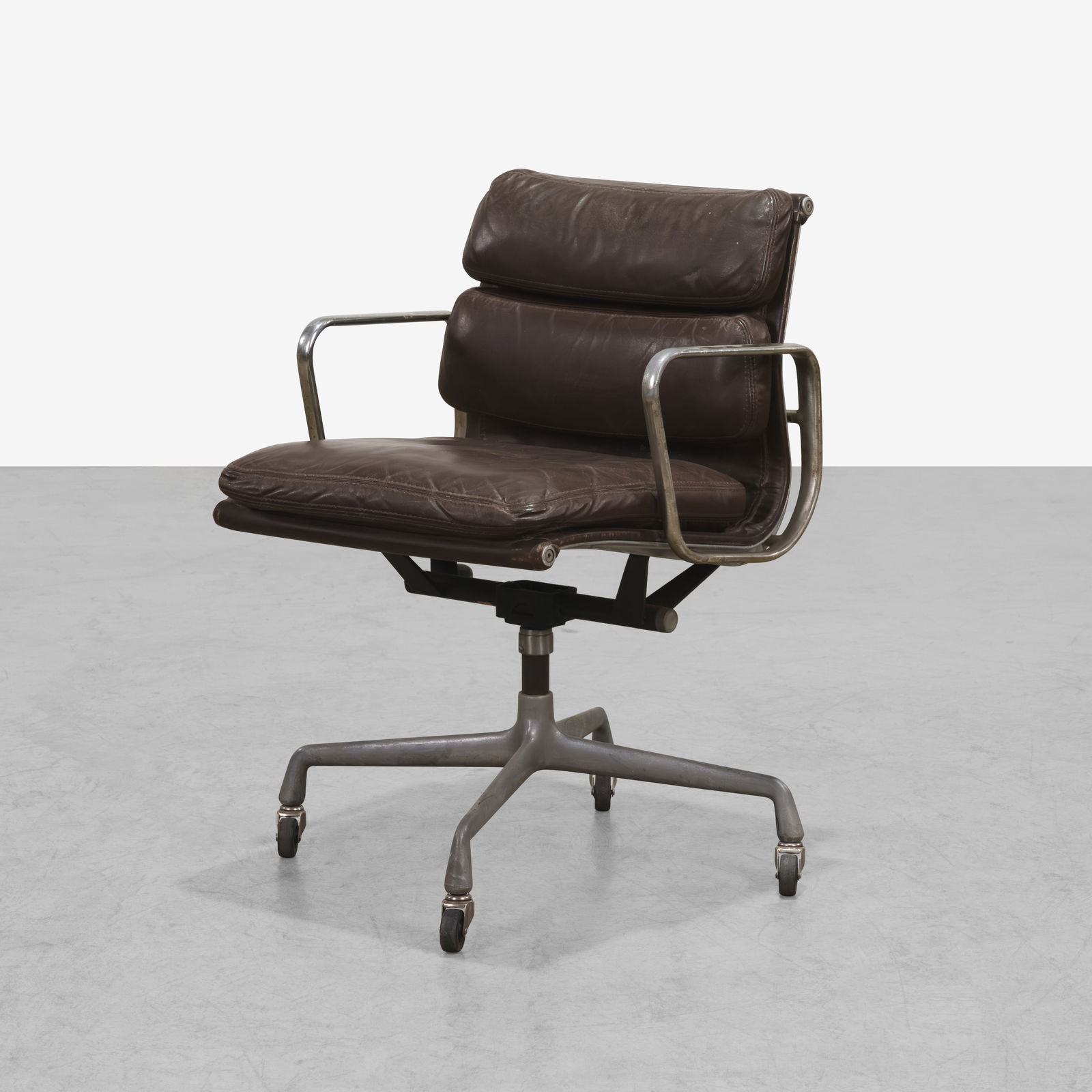 Charles & Ray Eames - Soft Pad Chair: A vintage 'Soft Pad' chair by Charles and Ray Eames for Herman Miller. All measurements are in inches. Height x Width x Depth