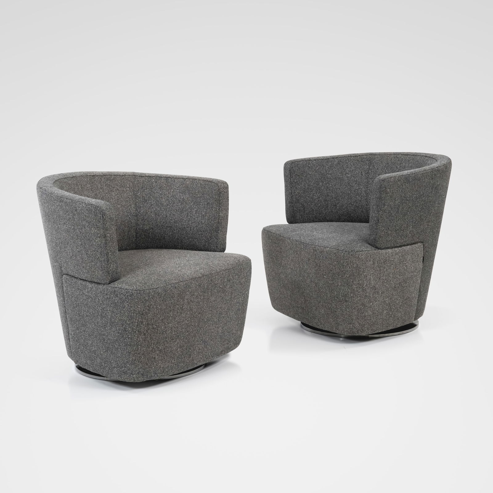 EOOS - Swivel Chairs: A pair of 'Joel' swiveling lounge chairs by EOOS for Walter Knoll. All measurements are in inches. Height x Width x Depth