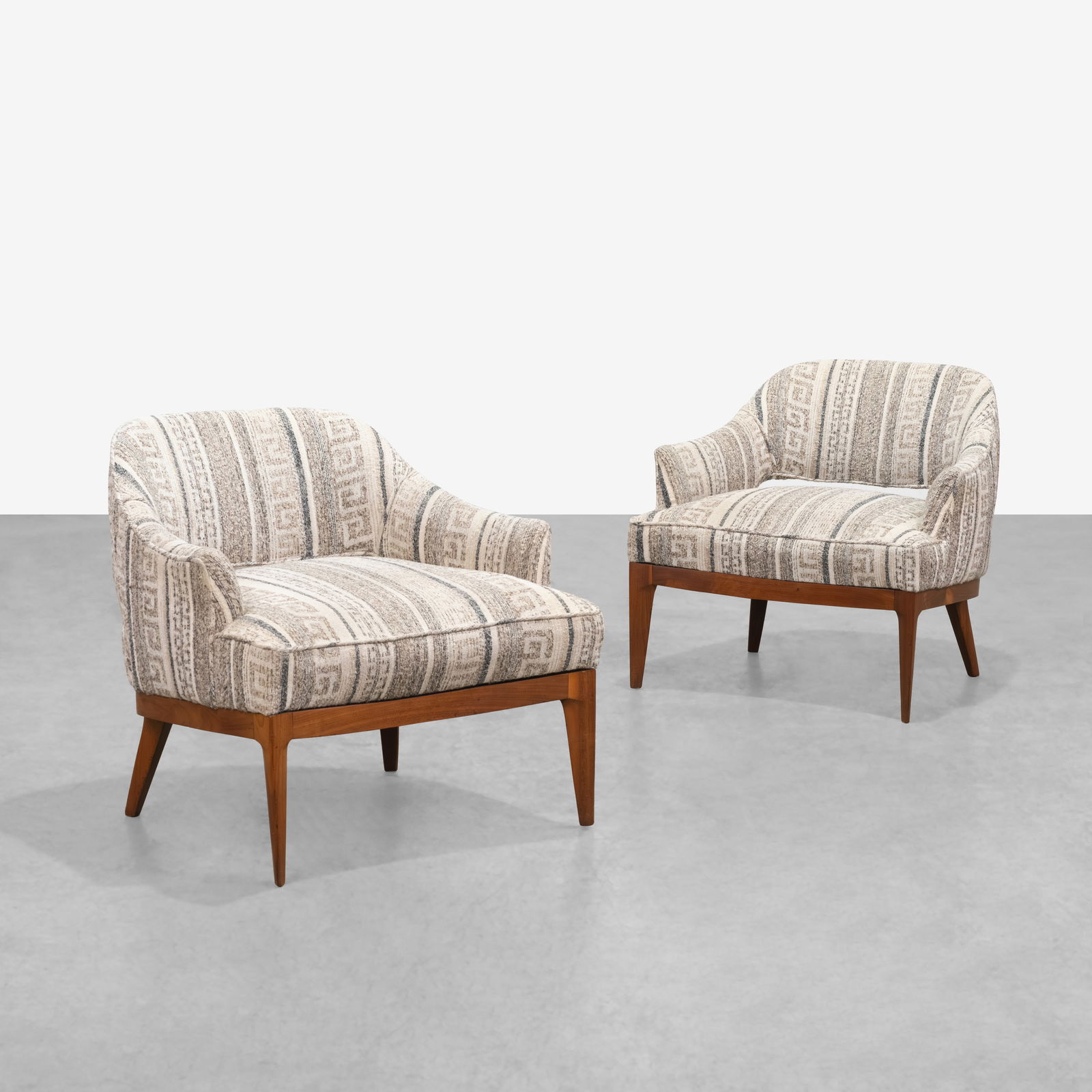 Vintage Slipper Chairs: A pair of vintage slipper chairs with walnut bases by John Stewart. All measurements are in inches. Height x Width x Depth