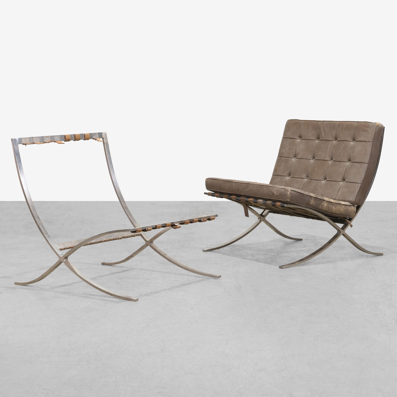 Mies Van Der Rohe - Barcelona Chairs: A pair of vintage 'Barcelona' chair frames by Mies Van Der Rohe for Knoll. All measurements are in inches. Height x Width x Depth