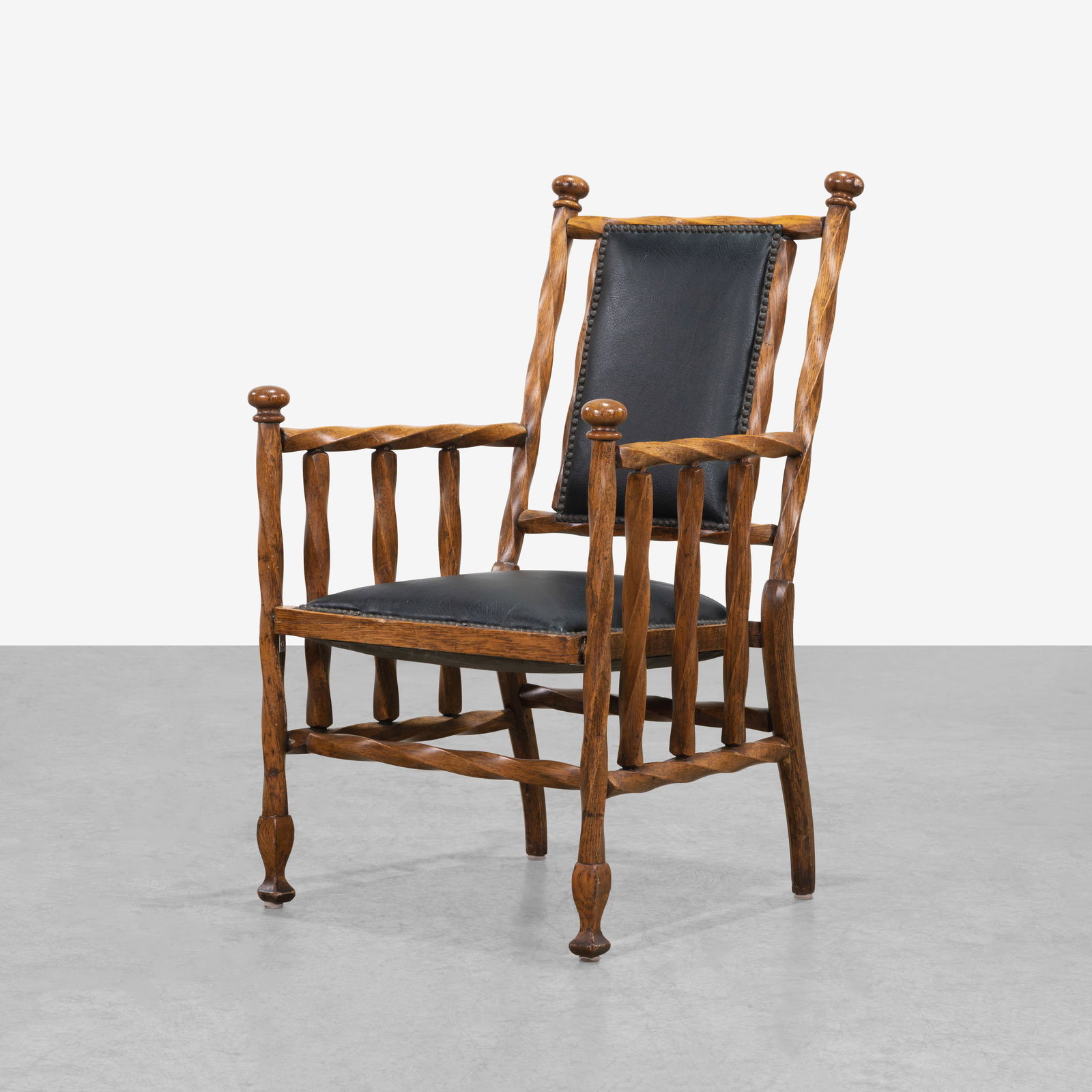 George Hunzinger (After) - Arm Chair: A twisted oak arm chair in the manner of George Hunzinger. All measurements are in inches. Height x Width x Depth