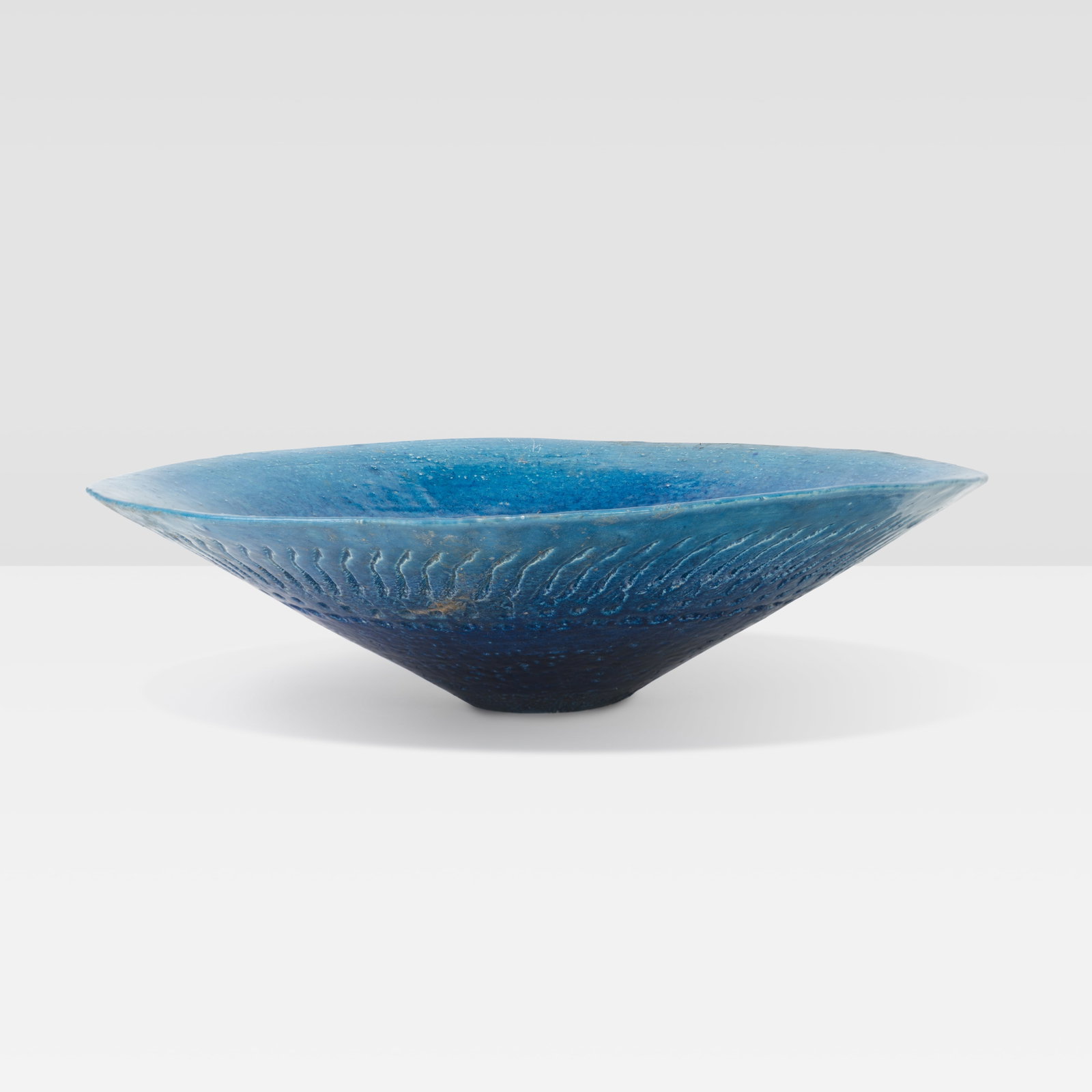 Japanese Pottery Bowl: A vintage Japanese pottery bowl with remnants of paper label.