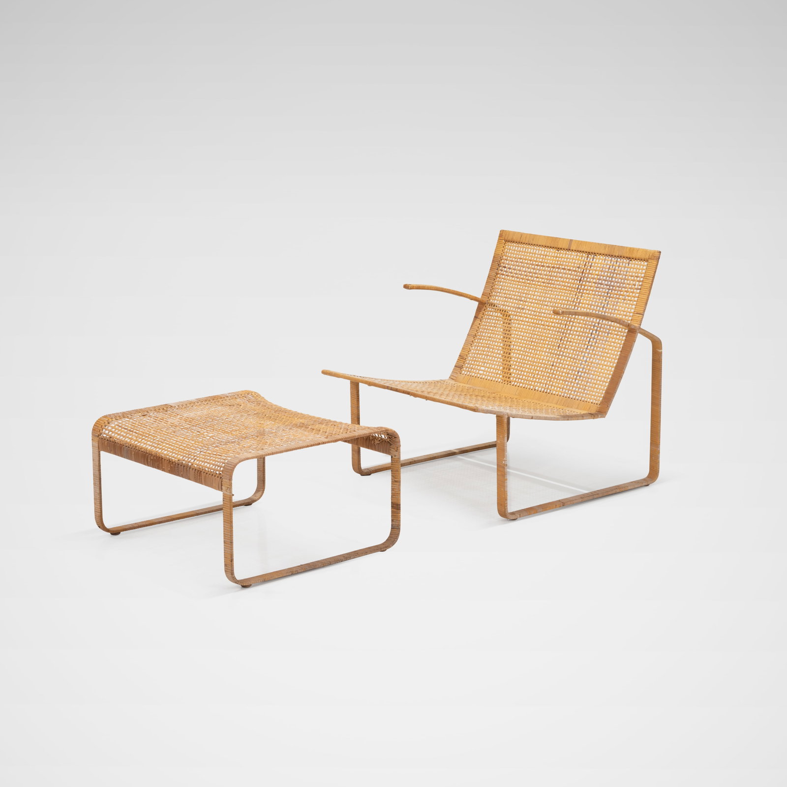 Harvey Probber - Chair & Ottoman: A cane wrapped steel lounge chair and ottoman for Harvey Probber's 'Artisan Collection'. Dimensions listed are for the chair. Ottoman - 13 x 25 x 22.5. All measurements are in inches. Height x Width