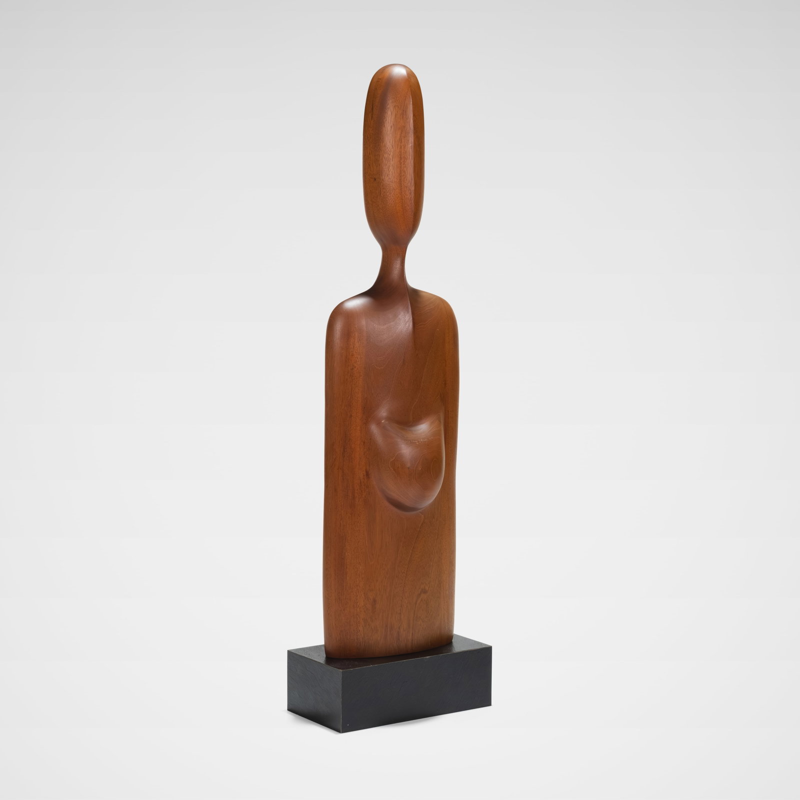 Margery Eleme Goldberg - Abstract Sculpture: A large abstract figural carved walnut sculpture on a faux slate plinth by Margery Eleme Goldberg. Signed and dated '2-77'. All measurements are in inches. Height x Width x Depth