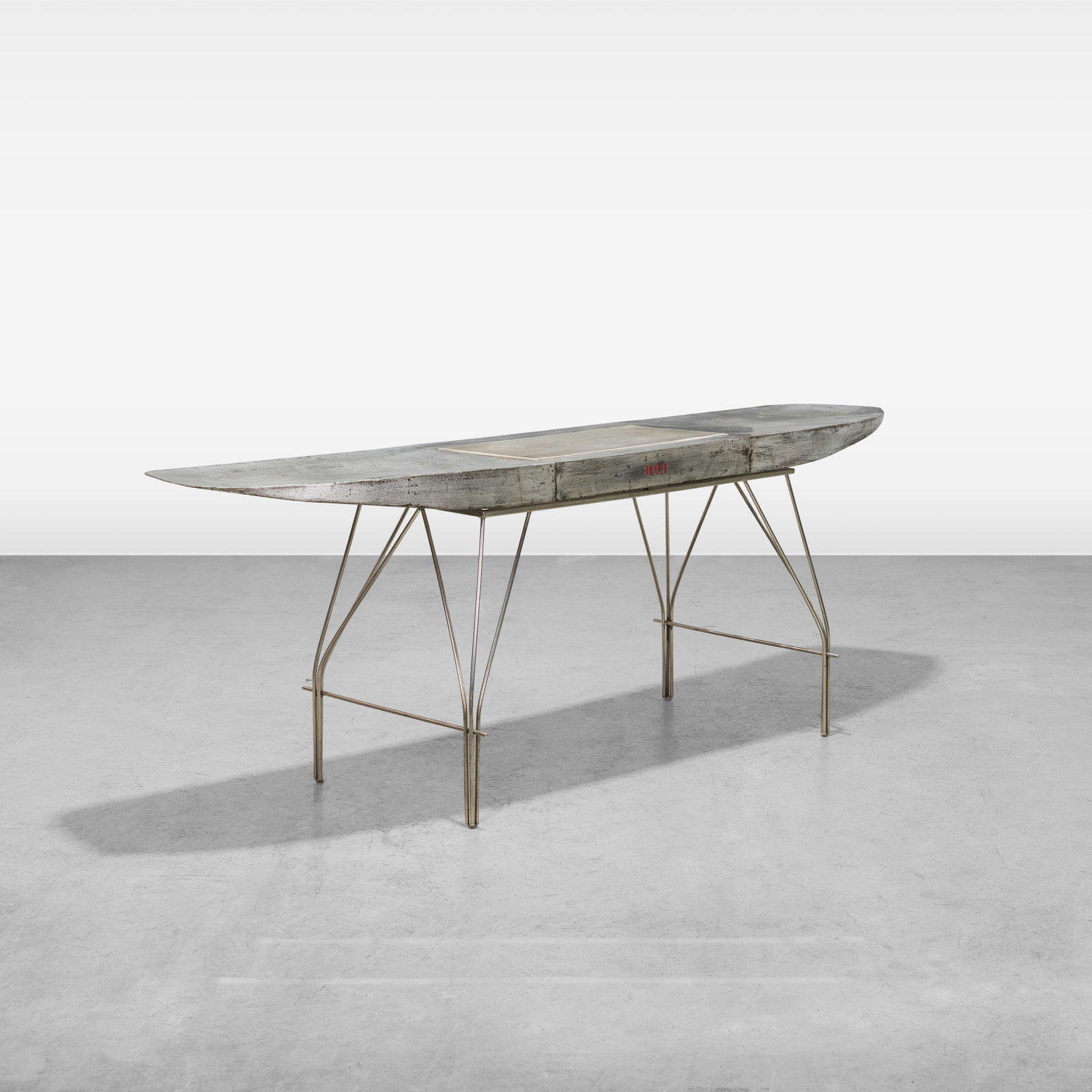 Jonathan Singleton - Desk: A vintage airplane wing desk with leather writing surface by Jonathan Singleton. All measurements are in inches. Height x Width x Depth