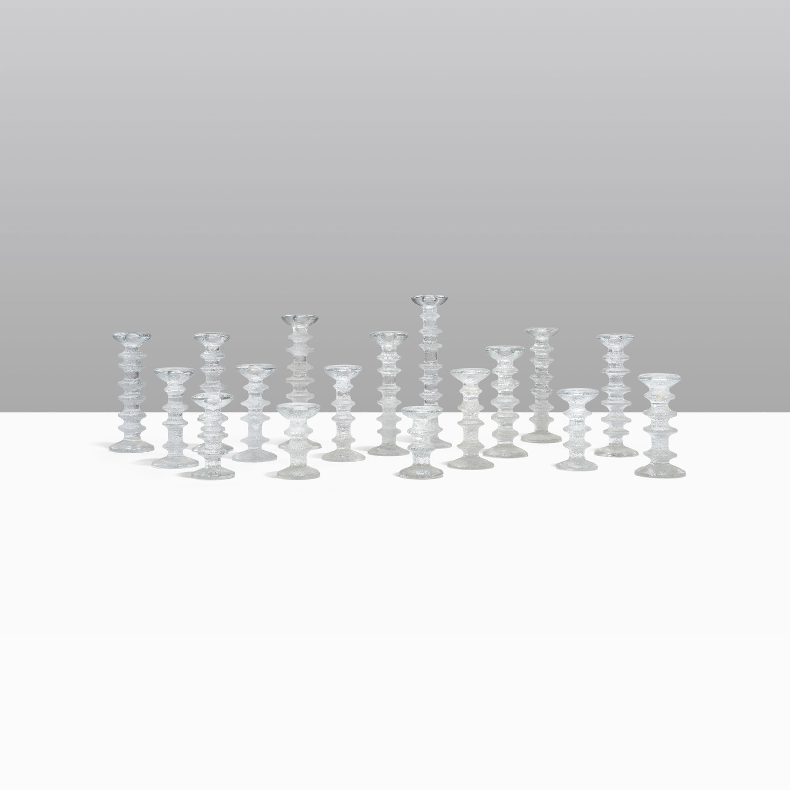 Timo Sarpaneva - Candlesticks: A large collection of 'Festivo' candlesticks by Timo Sarpaneva. Dimensions listed are for the largest candlestick. Other heights include - 5", 5.75", 7", 8.5", 9.5", 10", 11". All measurements are in
