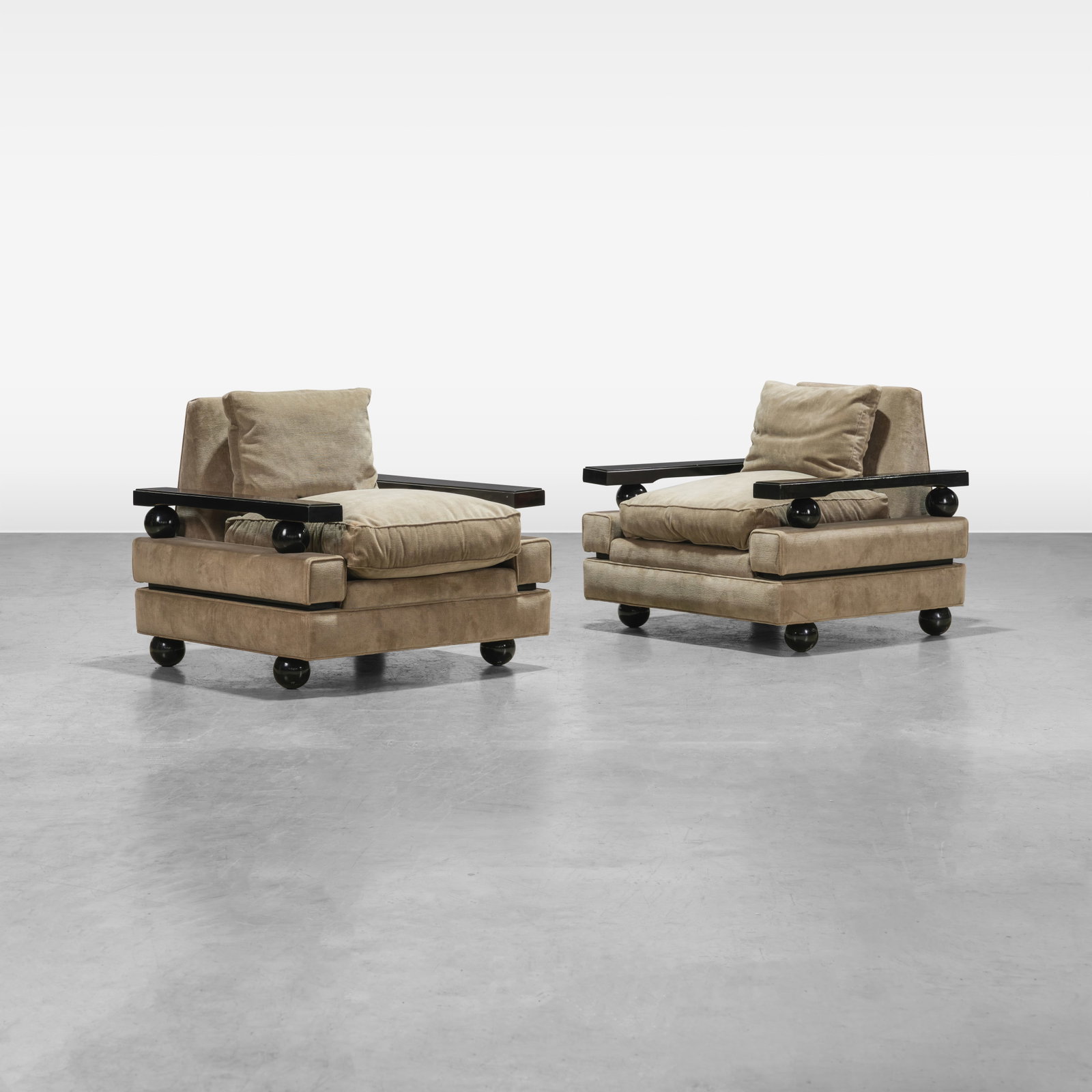 Jean Royere Style - Lounge Chairs: A pair of lounge chairs in the style of Jean Royere. All measurements are in inches. Height x Width x Depth