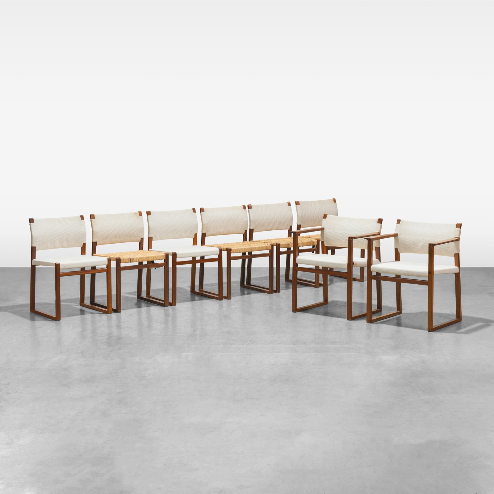 Borge Mogensen - Dining Chairs: A set of ten dining chairs by Borge Mogensen. Includes two arms. Dimensions listed are for an arm chair. All measurements are in inches. Height x Width x Depth