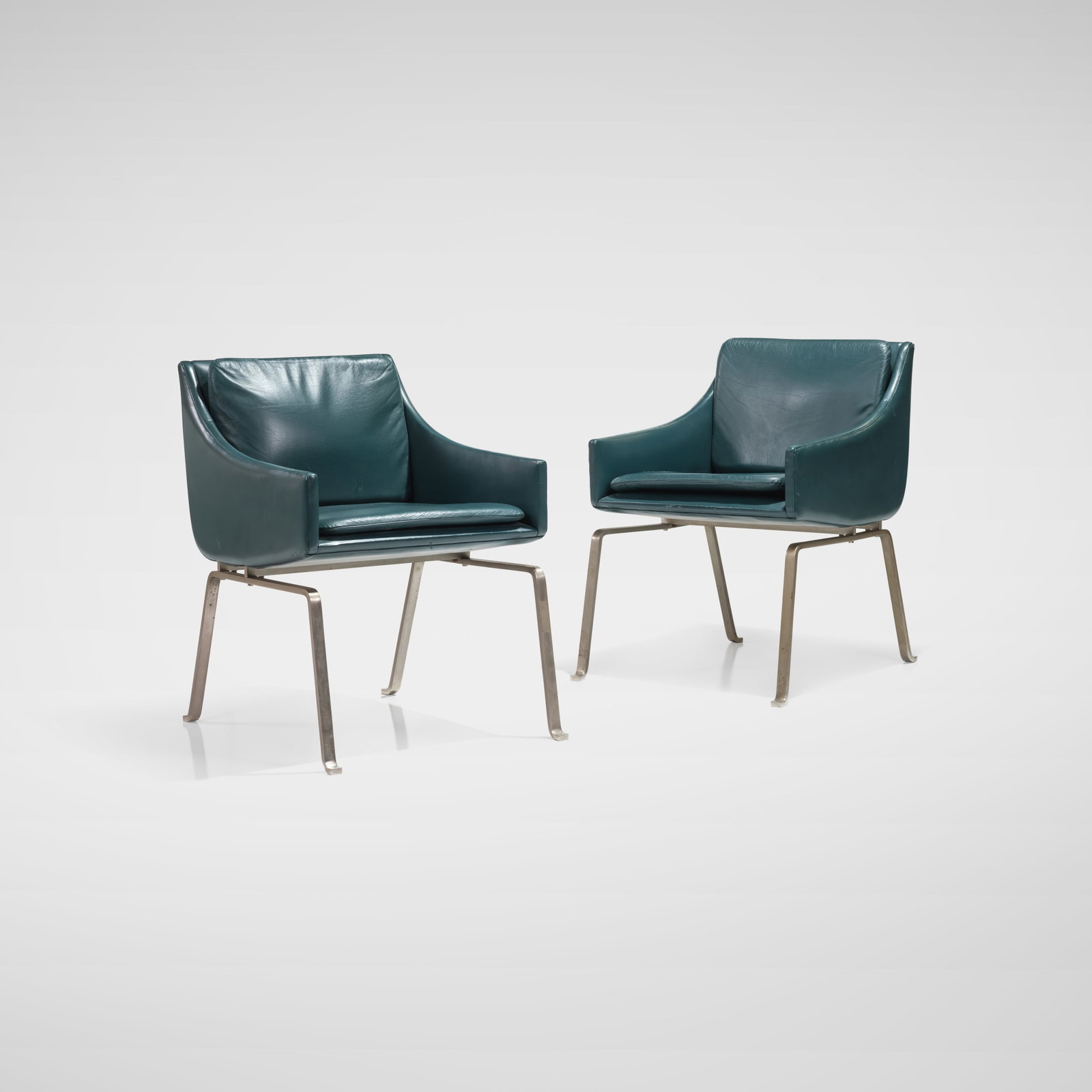 Poul Kjaerholm (Attr.) - Armchairs: A pair of leather and steel armchairs attributed to Poul Kjaerholm, possibly early prototypes. All measurements are in inches. Height x Width x Depth