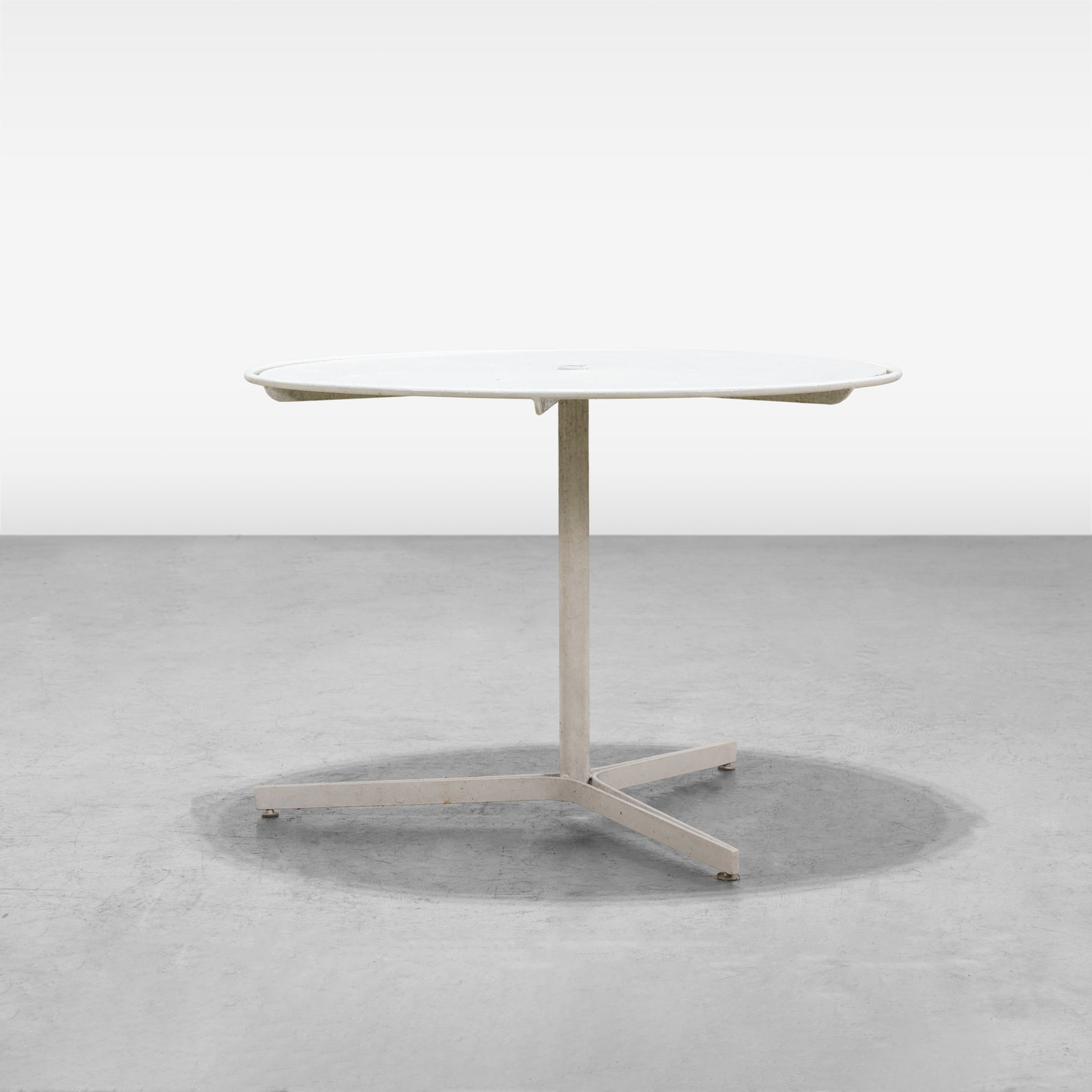 Vladimir Kagan - Capricorn Table: An iron 'Capricorn' patio table by Vladimir Kagan. All measurements are in inches. Height x Width x Depth