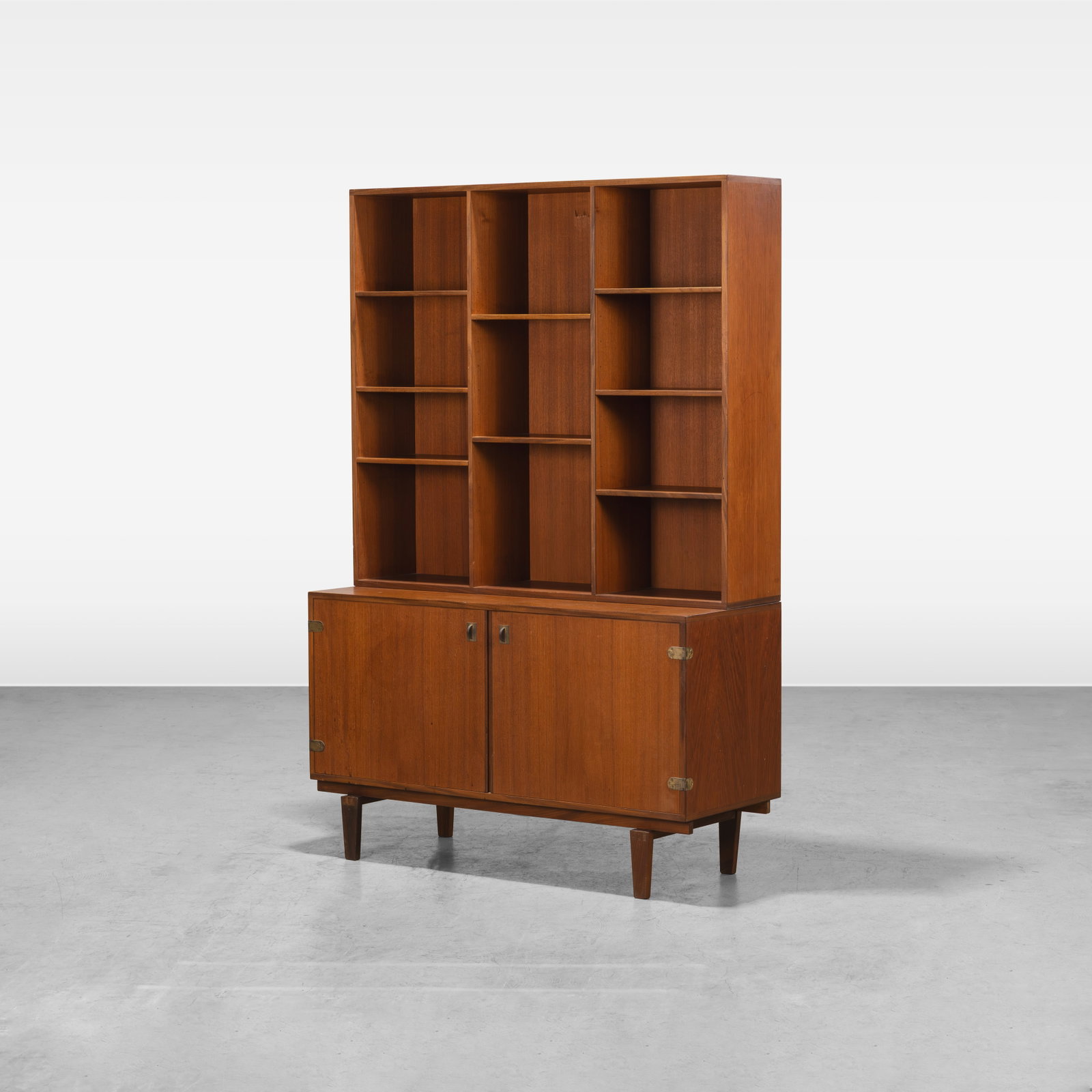 Peter Lovig Nielsen - Cabinet: A vintage teak cabinet with bookcase top by Peter Lovig Nielsen. All measurements are in inches. Height x Width x Depth