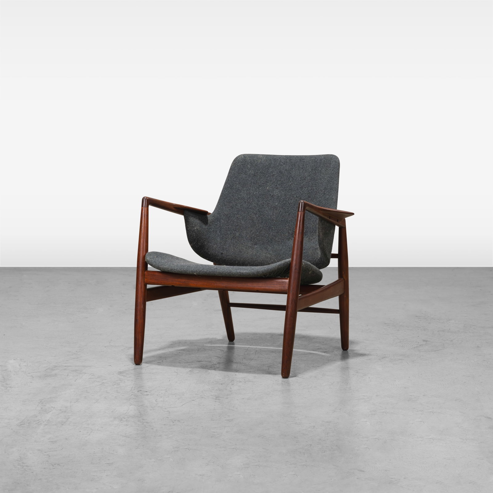 Ib Kofod Larsen - Lounge Chair: A rare teak lounge chair by Ib Kofod Larsen for Christensen and Larsen, Denmark. All measurements are in inches. Height x Width x Depth