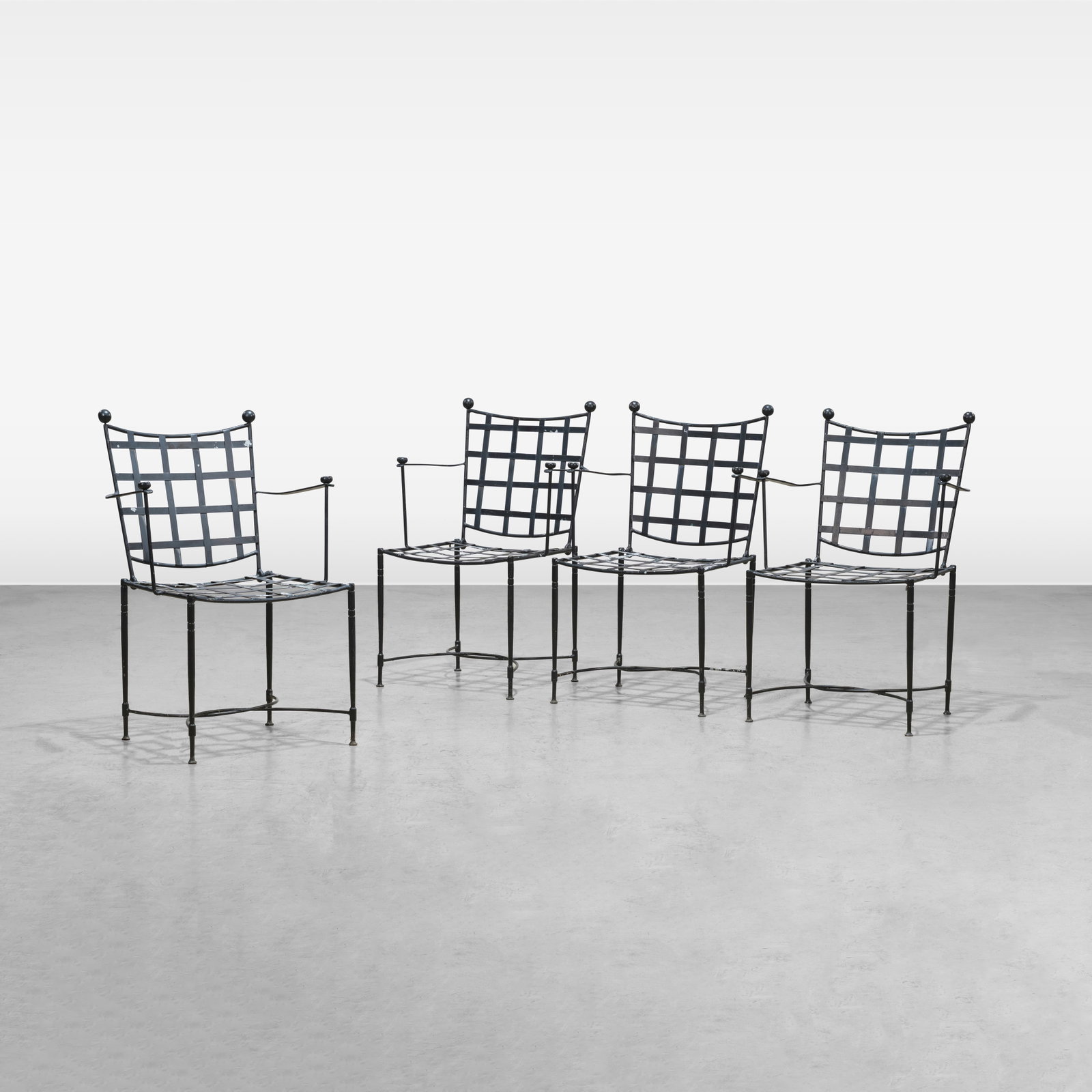 Mario Papperzini (After) - Chairs: A set of four wrought iron patio chairs in the manner of Mario Papperzini. All measurements are in inches. Height x Width x Depth