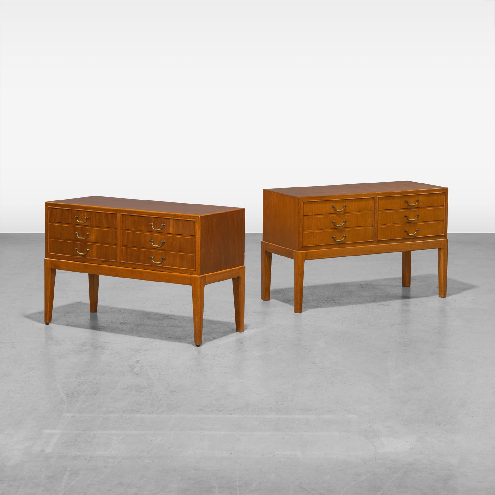 Ole Wanscher - Low Chests: A pair of matching six drawer low chests by Ole Wanscher. One features a stamp on the back. All measurements are in inches. Height x Width x Depth