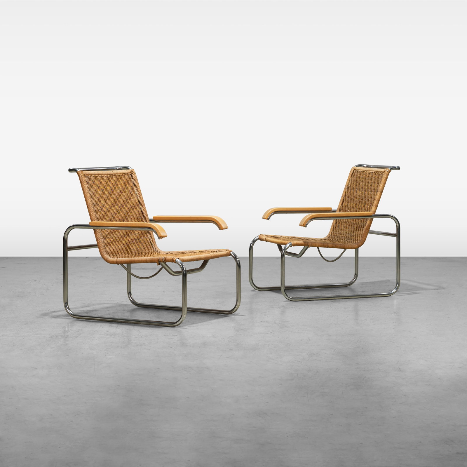 Marcel Breuer - Lounge Chairs: A pair of B35 lounge chairs by Marcel Breuer for ICF, Western Germany. One chair retains a label on stretcher. All measurements are in inches. Height x Width x Depth