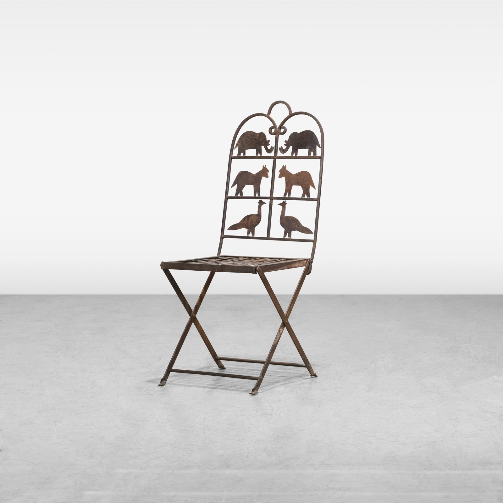 Jean Touret (Attr.) - Folding Chair: A French wrought iron folding chair attributed to Jean Touret for Atelier Marolles. All measurements are in inches. Height x Width x Depth