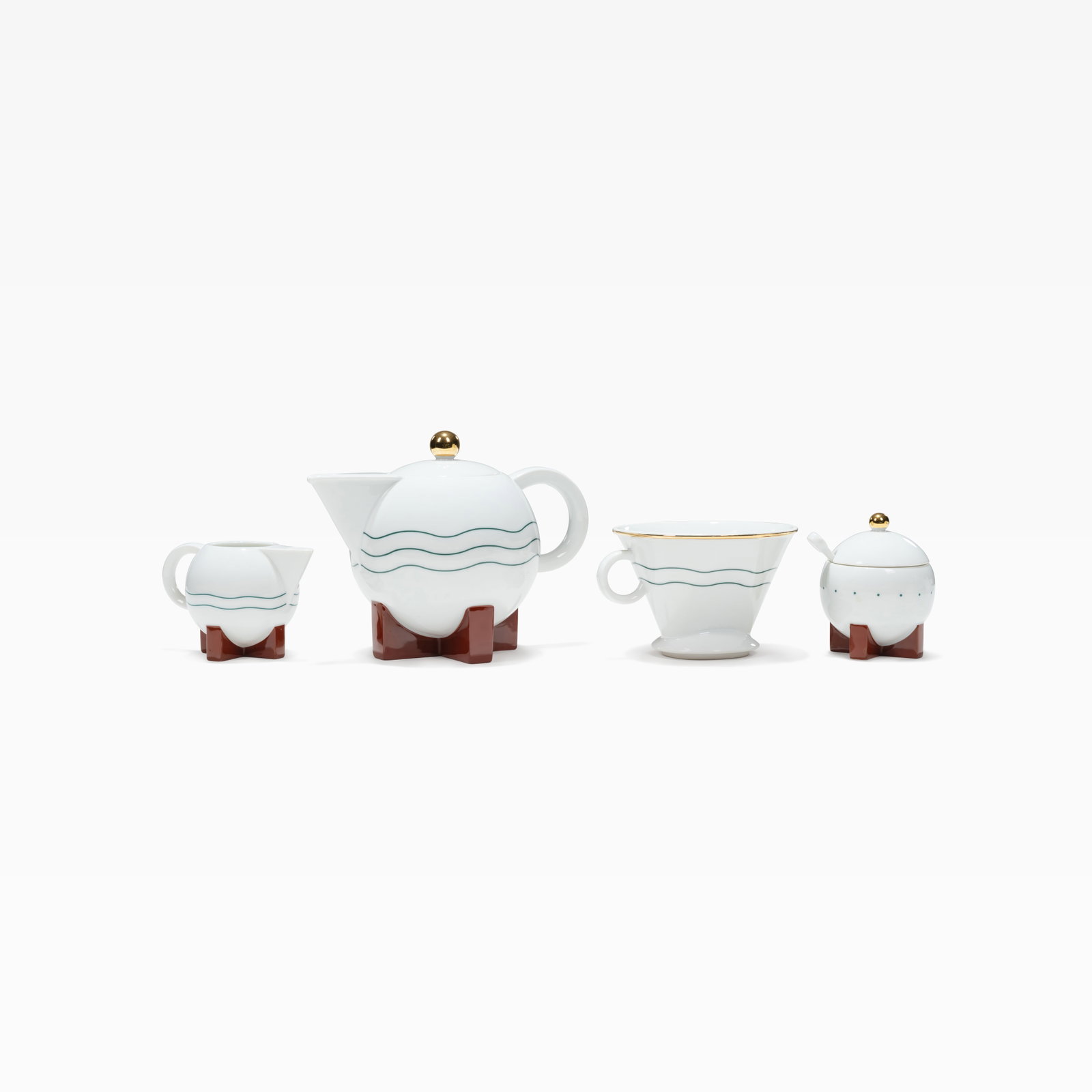 Michael Graves - Tea Service: A four piece coffee / tea service by Michael Graves for Swid Powell, 1987. Includes one teapot, creamer, sugar bowl, and a strainer / infuser. Dimensions are for the teapot. All measurements are in in