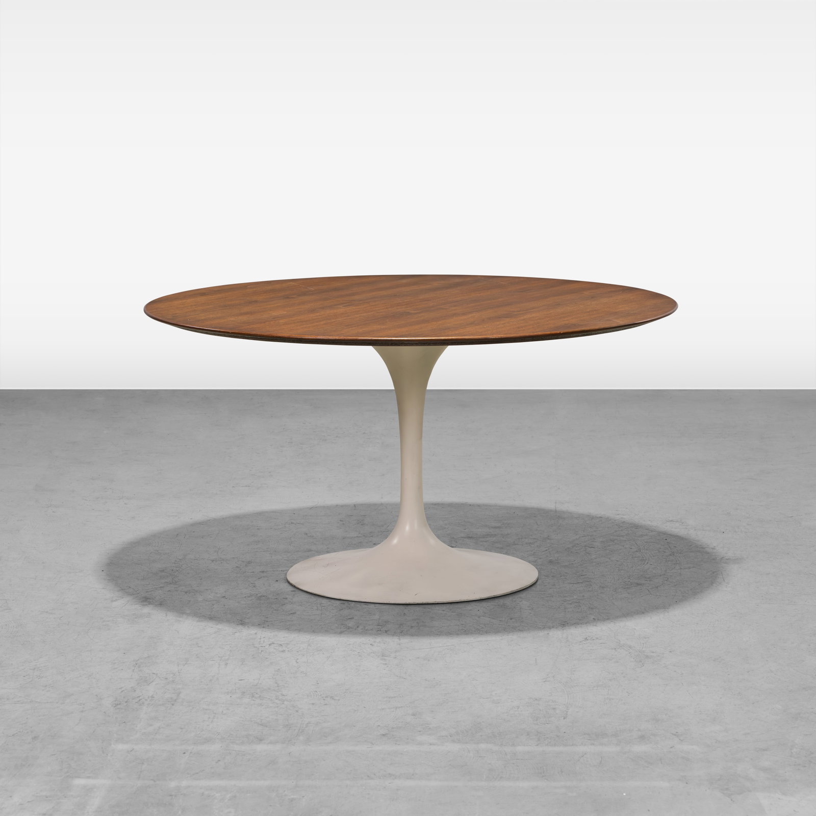 Eero Saarinen - Tulip Table: A walnut tulip table by Eero Saarinen for Knoll. All measurements are in inches. Height x Width x Depth