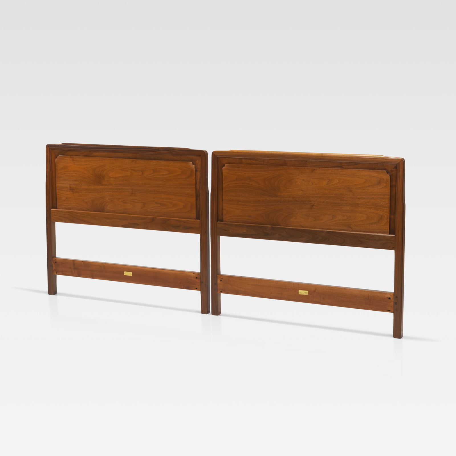Edward Wormley - Headboards: A pair of walnut headboards from the ‘Janus’ collection by Edward Wormley for Dunbar. All measurements are in inches. Height x Width x Depth